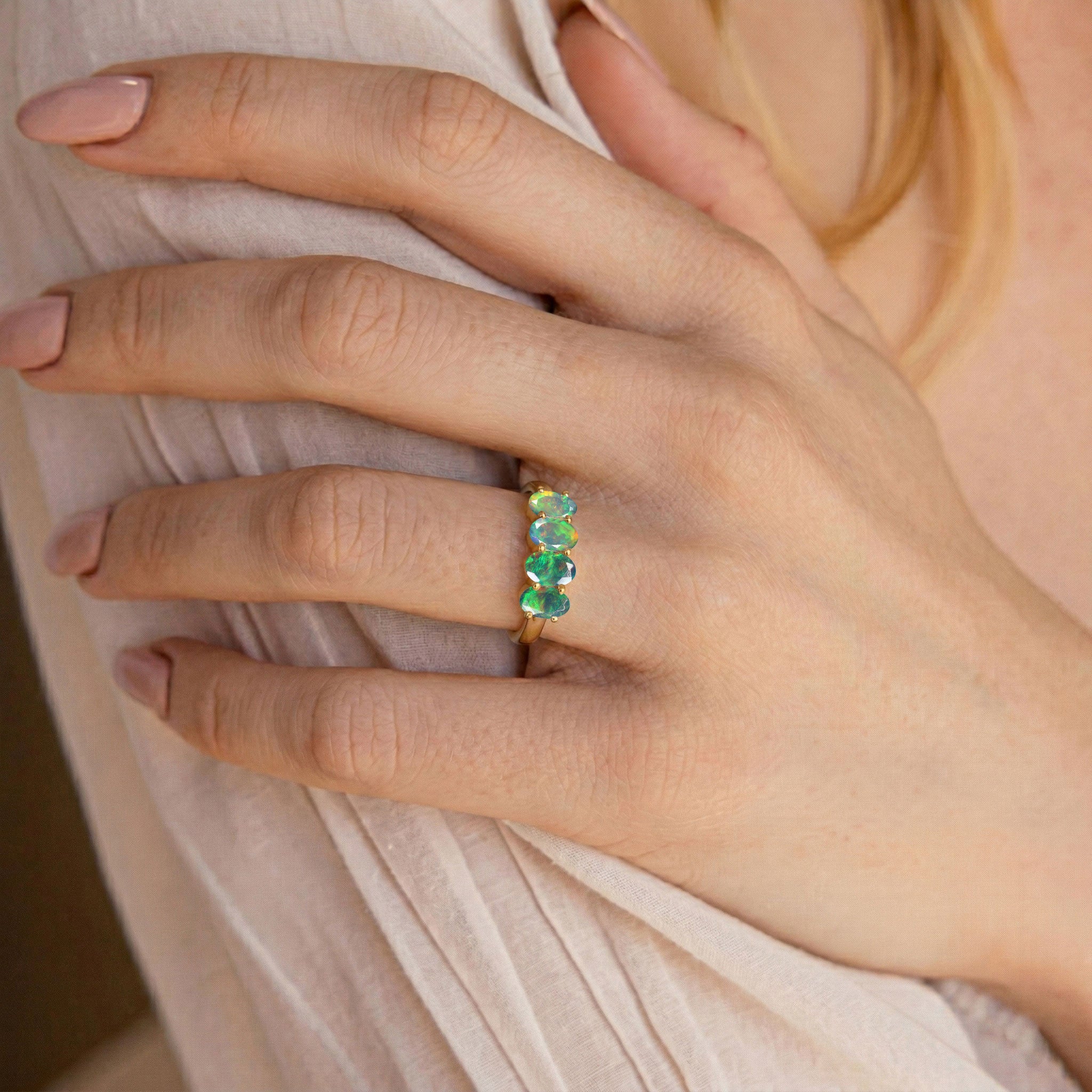 natural black opal statement ring, colorful fire opal jewelry, oval cut gemstone ring, sleek modern band, artisan crafted jewelry, anniversary jewelry gift, elegant stacking band, premium gemstone ring, women's luxury accessory, sophisticated everyday ring, unique opal design, vibrant gemstone colors