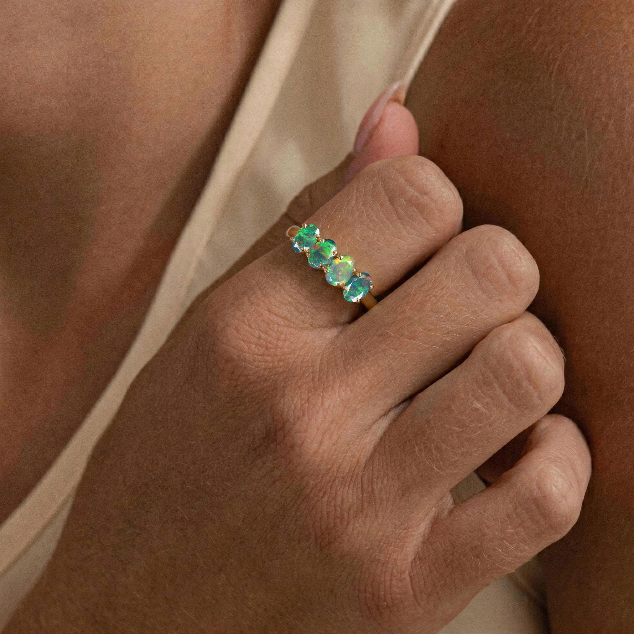 fine black opal jewelry, vibrant gemstone band ring, oval gemstone arrangement, handcrafted luxury accessory, premium silver jewelry, elegant women's fashion ring, colorful opal brilliance, October birthday jewelry, artisan gemstone craftsmanship, refined everyday style, timeless ring design, unique gift idea