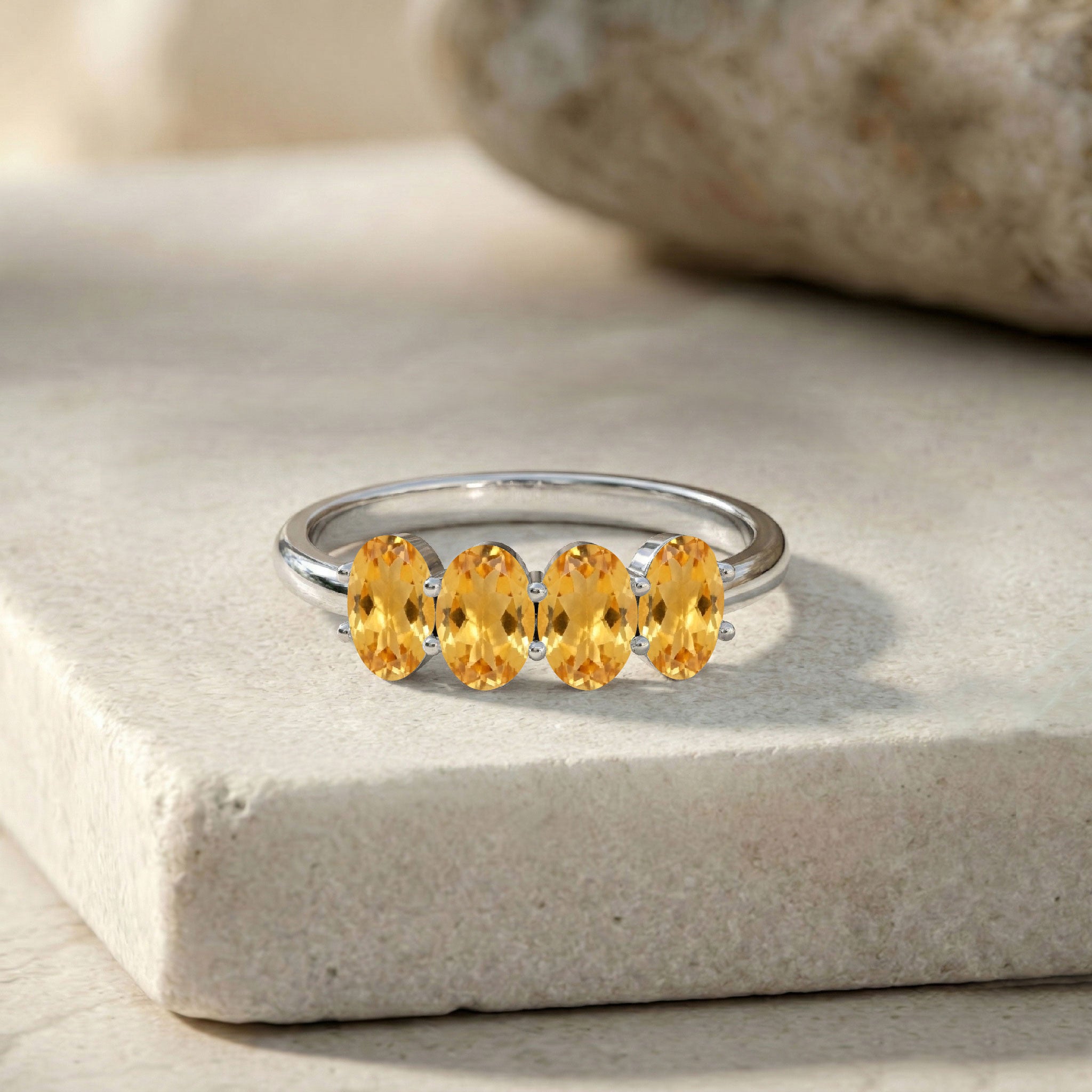 golden citrine jewelry, vibrant yellow gemstones, elegant band ring, fine gemstone accessory, women's stacking ring, handcrafted jewelry, oval gemstone design, sophisticated ring style, anniversary present, dainty luxury jewelry