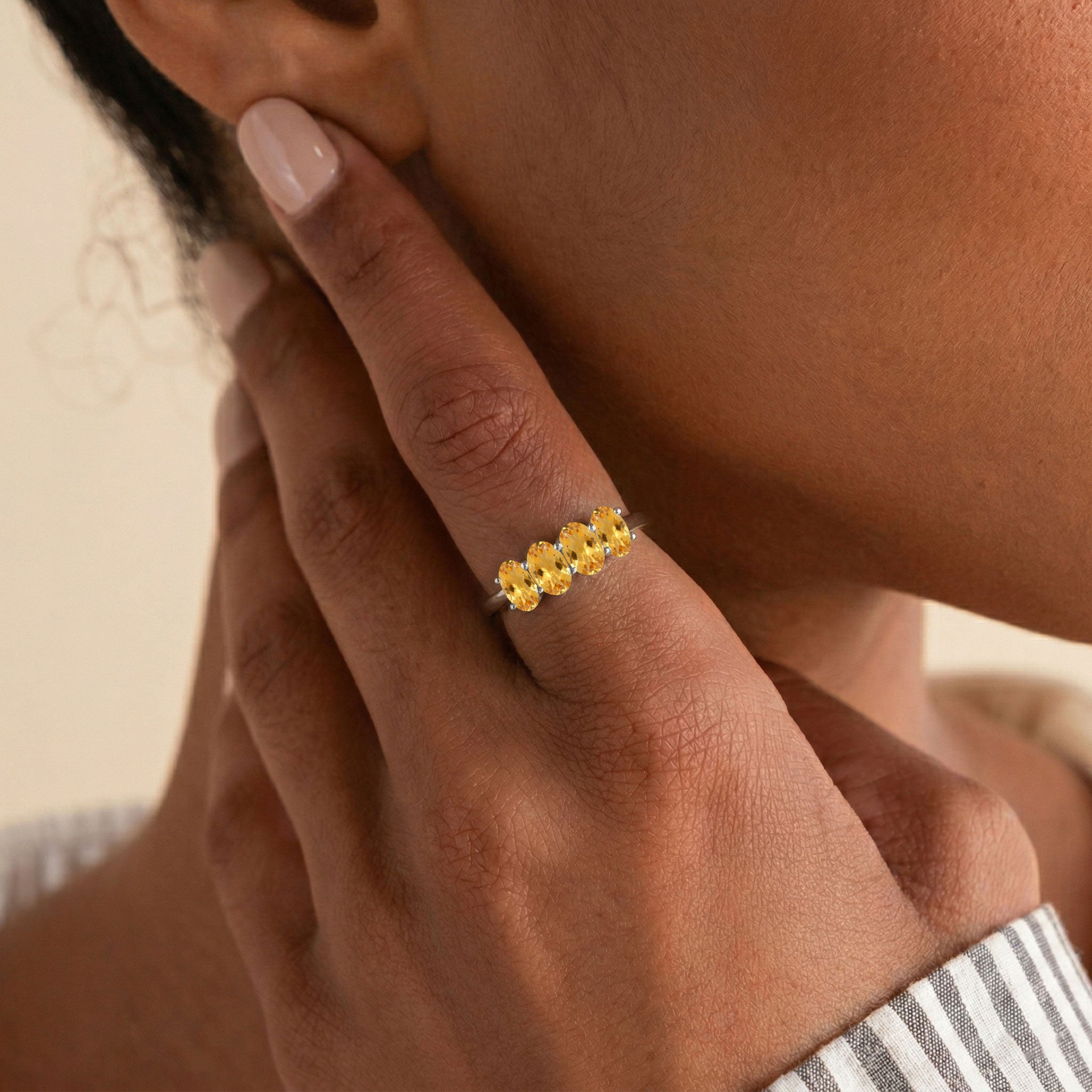 minimalist citrine jewelry, classic gemstone band, four oval stone ring, everyday fashion jewelry, sparkling yellow gemstone, refined jewelry design, artisan crafted ring, elegant gift for women, premium ring setting, timeless elegance