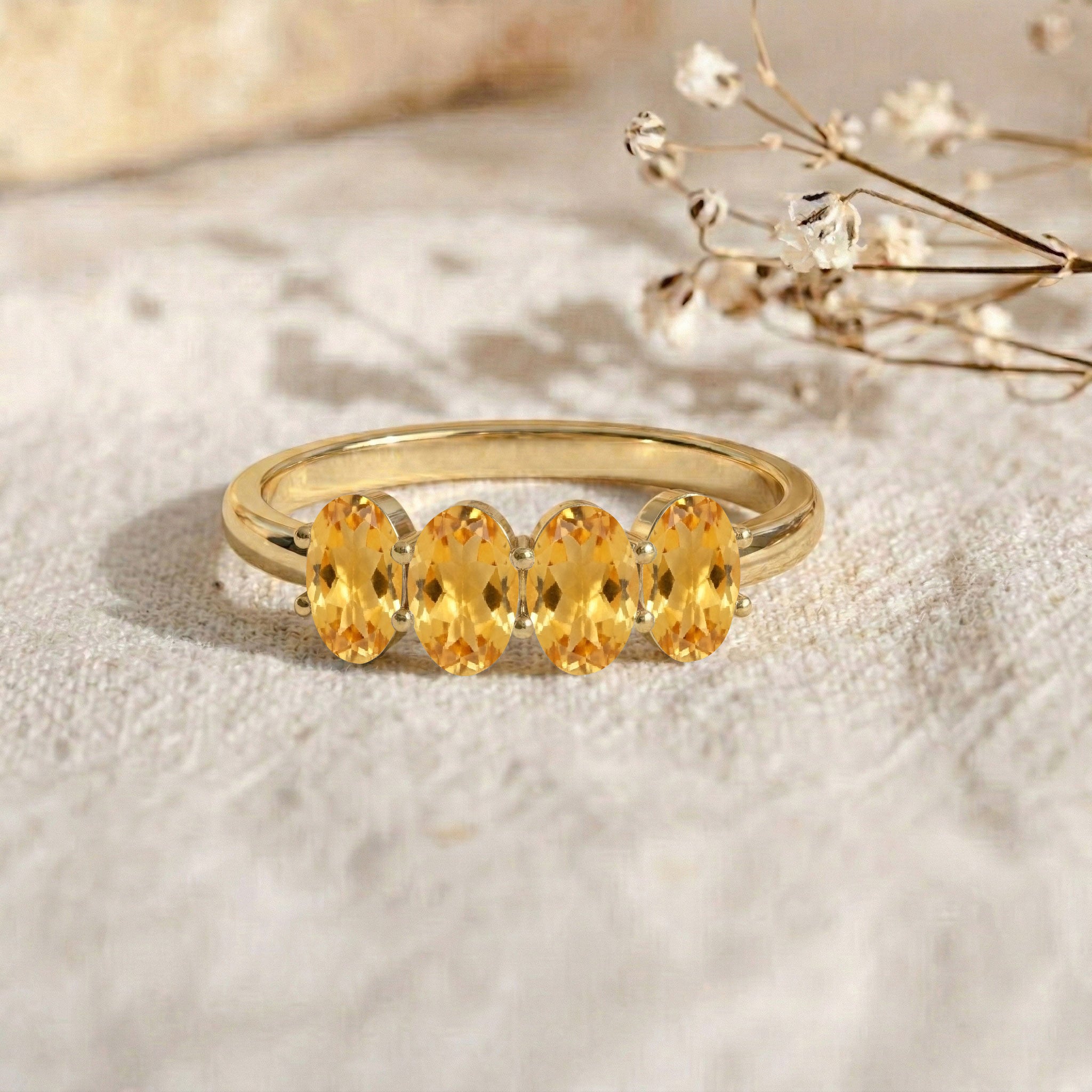 natural oval citrine, contemporary gemstone ring, four gemstone band, minimalist jewelry gift, elegant fashion accessory, slim band ring, classic citrine jewelry, sparkling gemstone ring, fine handmade ring, everyday elegance