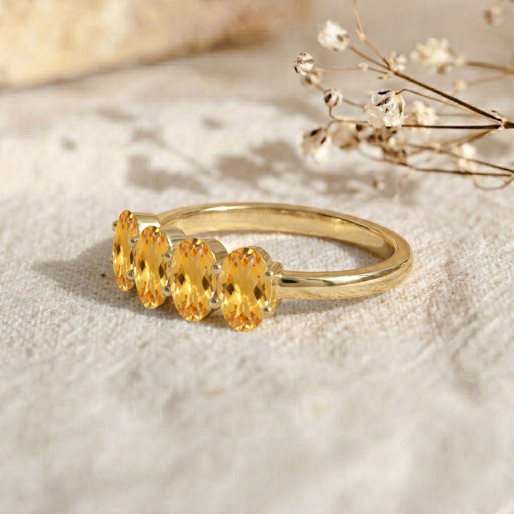 oval gemstone jewelry, premium citrine ring, bright golden gemstone, contemporary fine jewelry, handcrafted birthstone ring, sleek band style, feminine jewelry accessory, elegant anniversary ring, sparkling gemstone gift, modern elegance