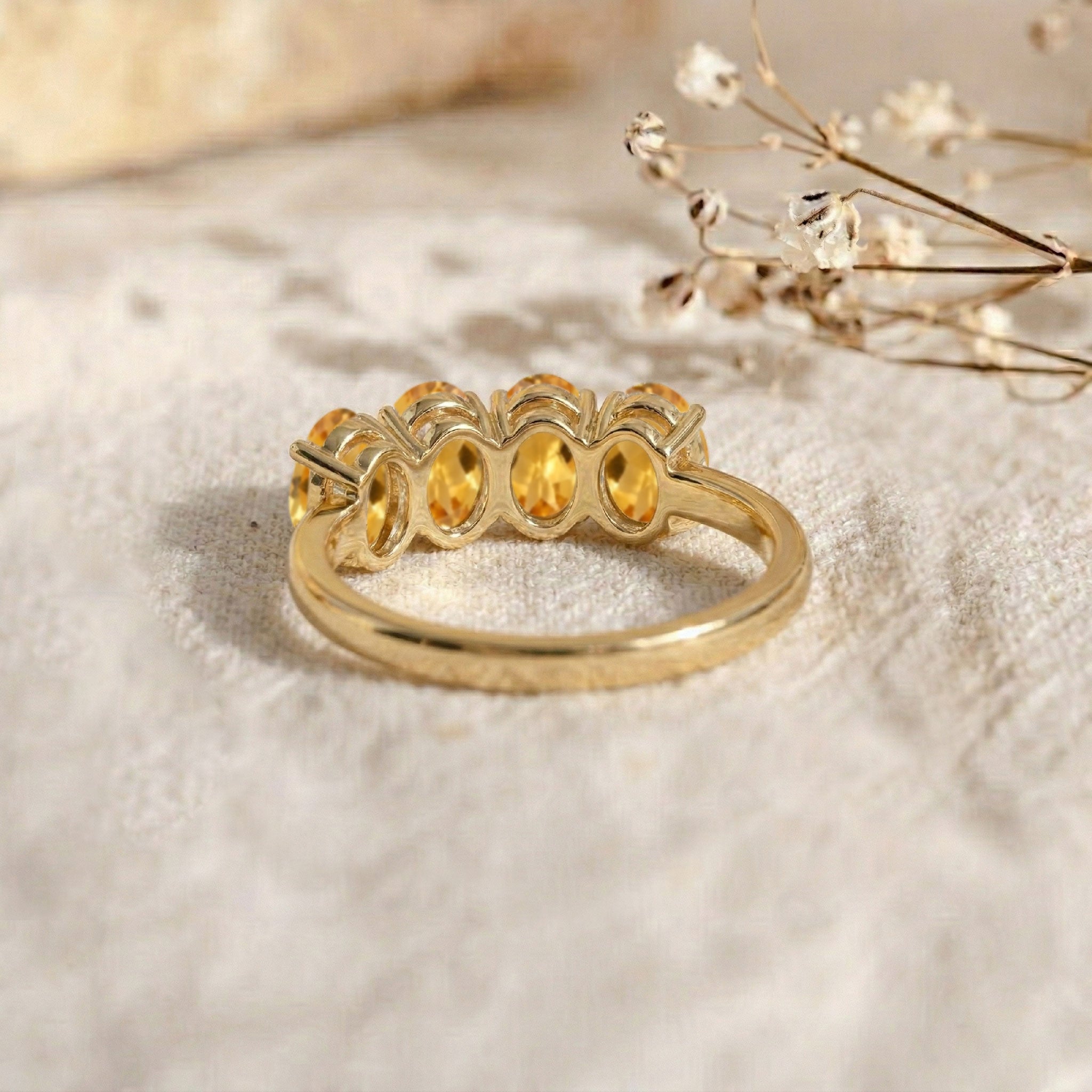 natural gemstone fashion, luxury citrine band, oval cut yellow stones, refined handcrafted ring, fashionable jewelry gift, elegant stacking accessory, timeless gemstone style, artisan jewelry design, polished finish ring, everyday wear jewelry