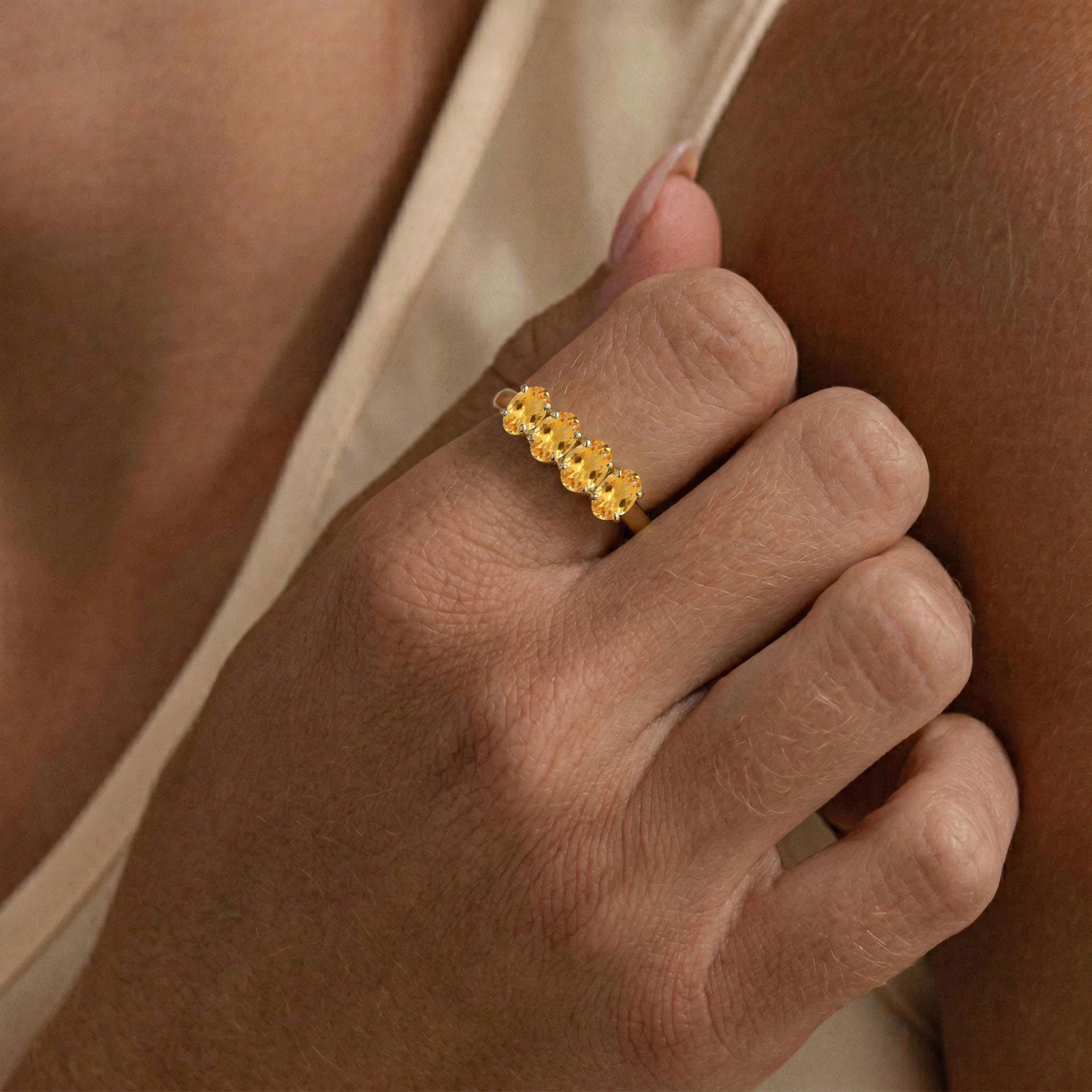 yellow gold jewelry, natural gemstone accessory, elegant four stone design, fine jewelry gift, oval faceted citrine, stylish gemstone band, everyday luxury ring, artisan made jewelry, November gift idea, sophisticated style