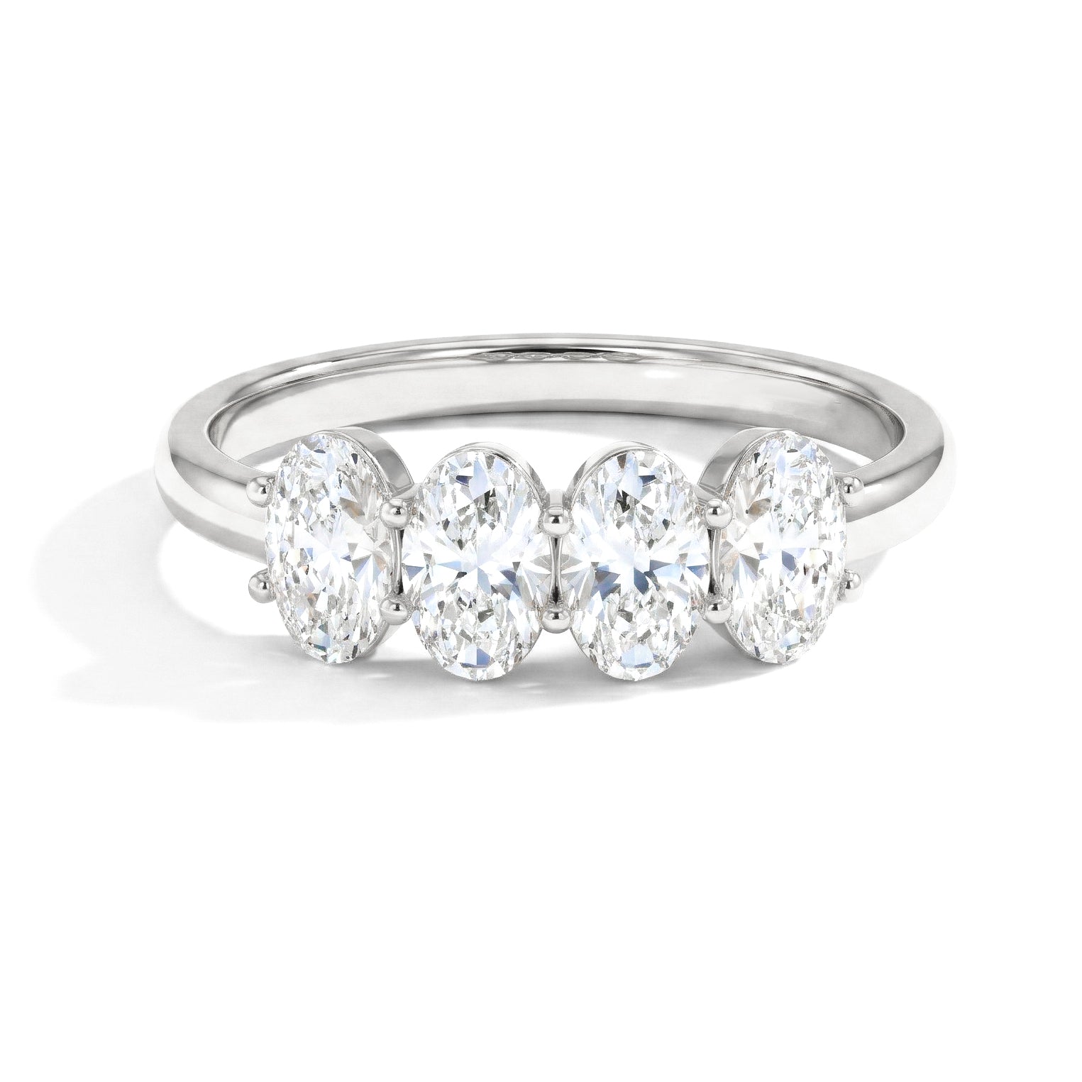 moissanite ring, four stone ring, oval moissanite ring, brilliant gemstone ring, sparkling ring, minimalist jewellery, elegant stacking ring, bridal ring, anniversary gift, women's jewellery, statement ring, luxury jewellery, polished band