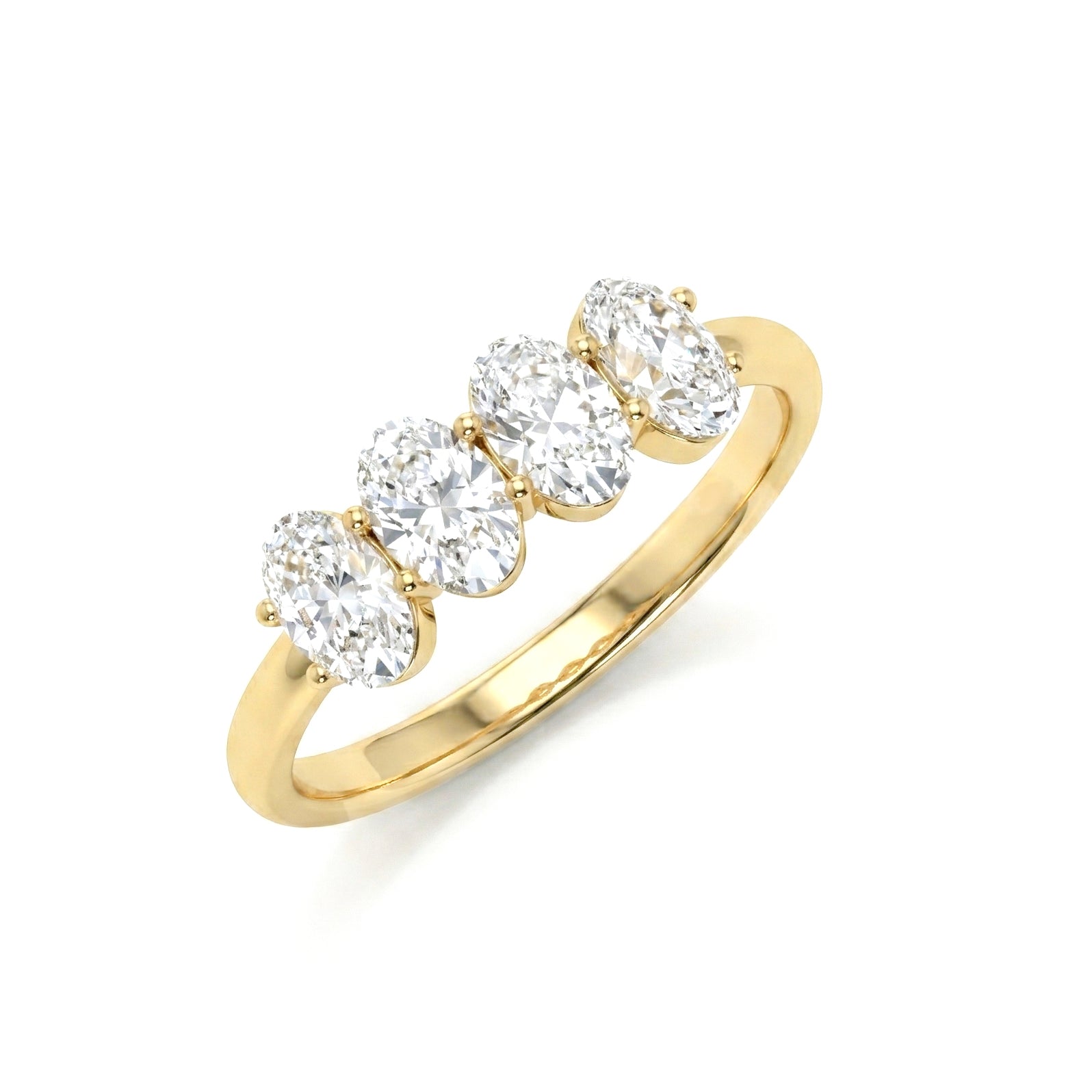 A yellow gold ring featuring four oval-cut clear gemstones in a row, set on a polished band against a plain white background.