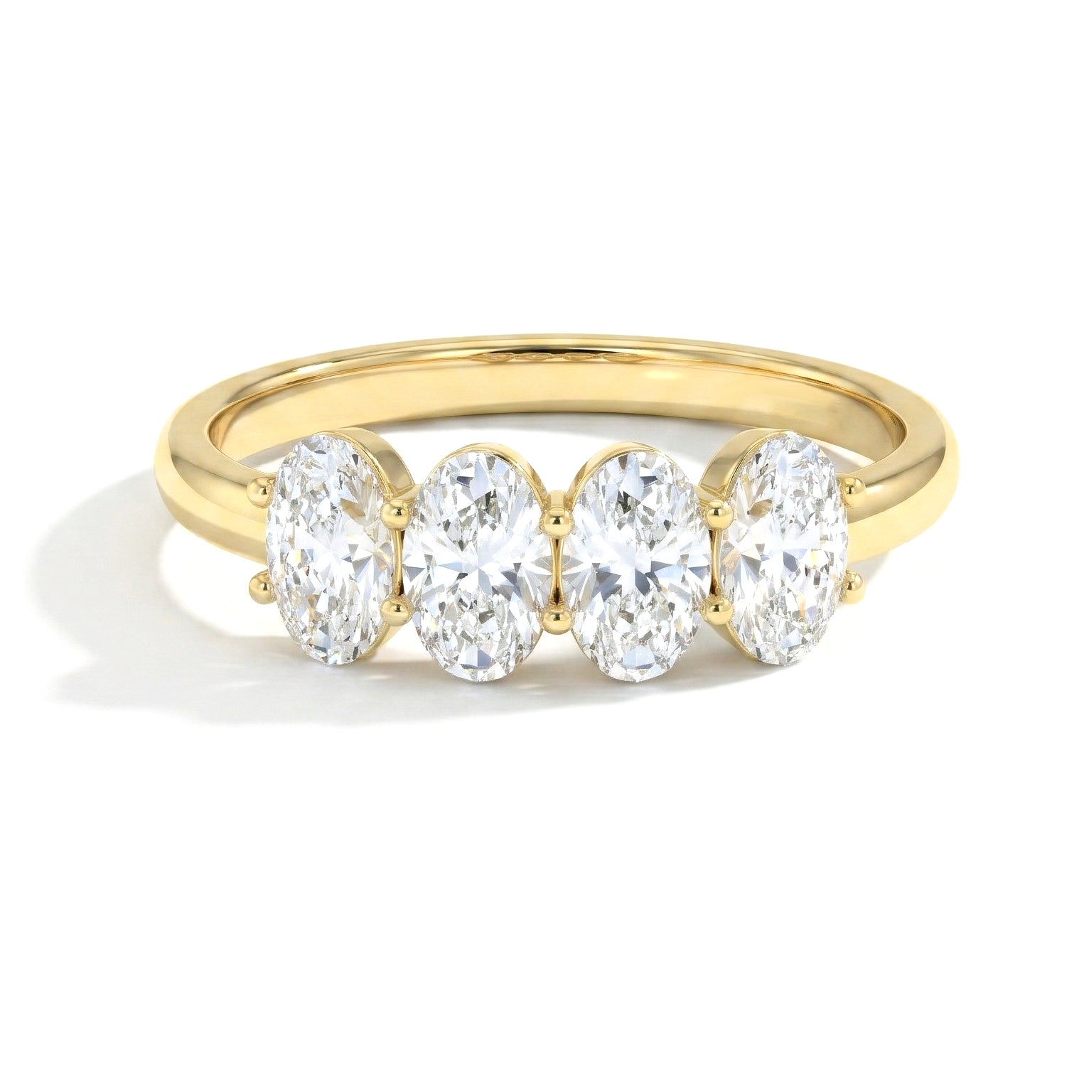 brilliant gemstone ring, four moissanite stones, refined jewellery design, contemporary women's accessory, polished handcrafted ring, elegant fashion jewellery, luxury stacking band, statement jewellery, anniversary keepsake, bridal inspiration, premium craftsmanship, timeless beauty