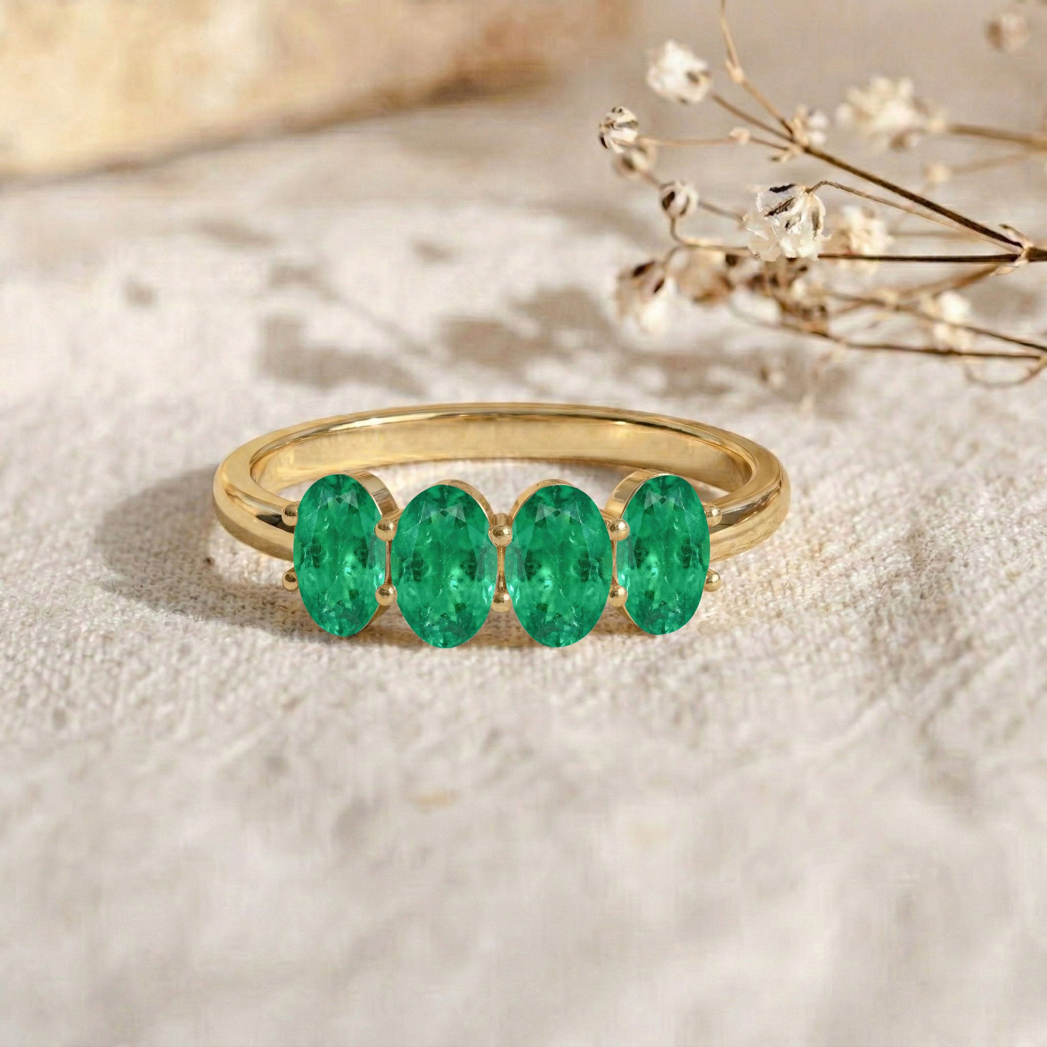 emerald wedding band, four gemstone band, polished ring, delicate jewelry, emerald anniversary gift, unique stacking ring, oval gemstone jewelry, everyday elegance, modern bridal accessory, stylish ring, green crystal jewelry, gift for her