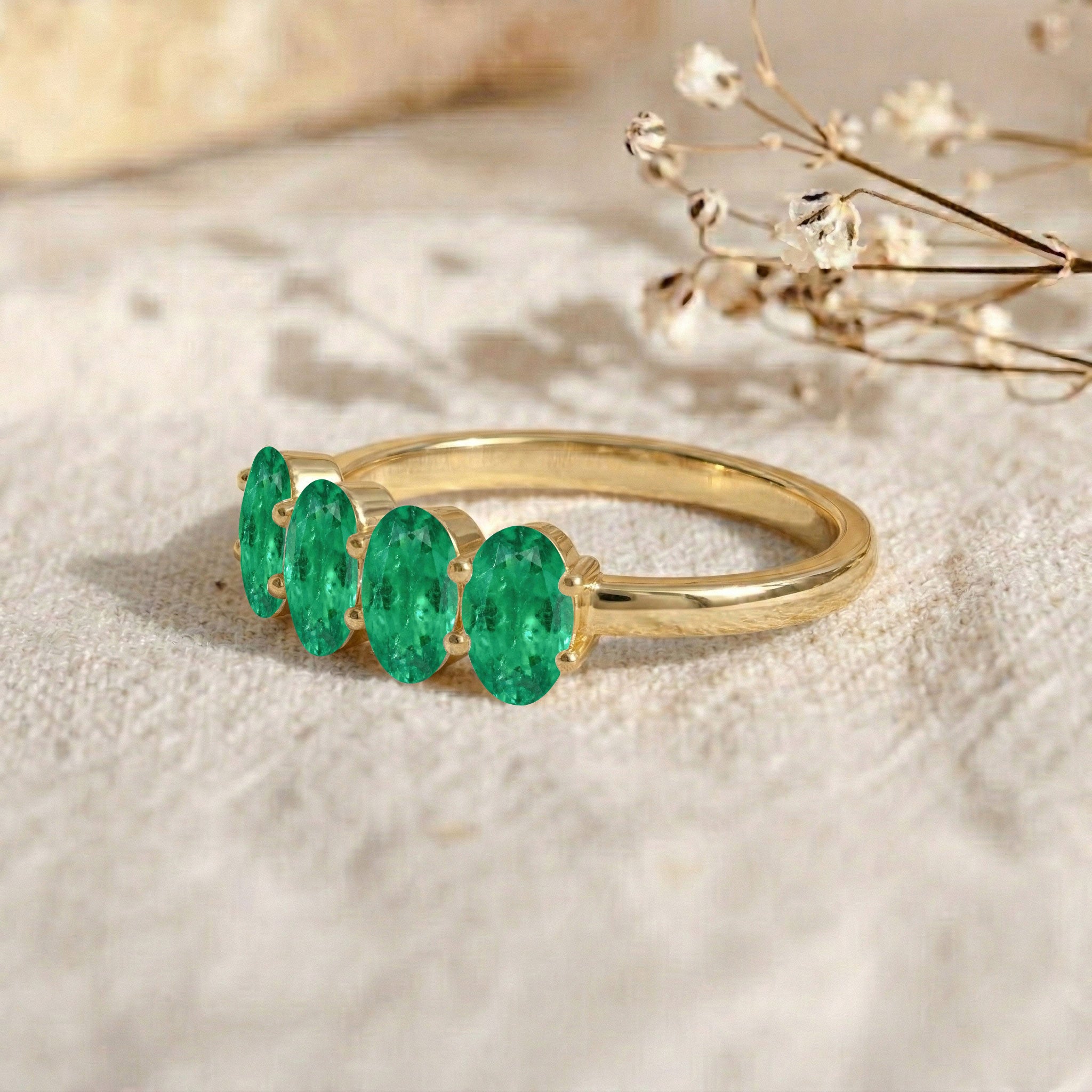 green birthstone ring, emerald gemstone accessory, oval luxury ring, elegant fashion jewelry, sophisticated stacking ring, refined jewelry style, artisan crafted band, polished gemstone setting, gift for wife, meaningful jewelry, modern elegance, stylish accessory