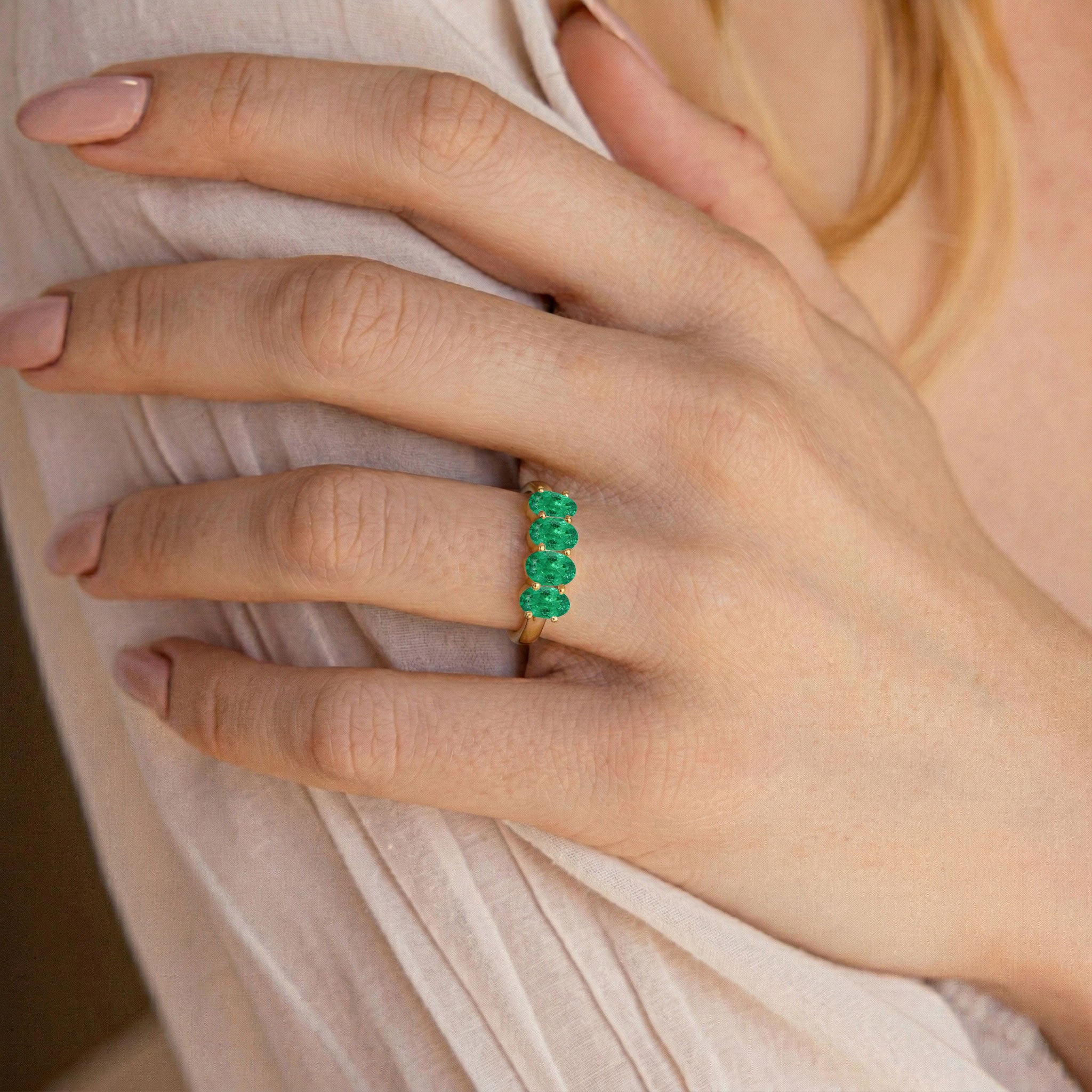 four oval gemstone ring, emerald engagement ring, slim band ring, everyday jewelry, fine jewelry gift, classic emerald band, luxury ring, green birthstone jewelry, elegant fashion ring, timeless design, stacking jewelry, oval cut stones