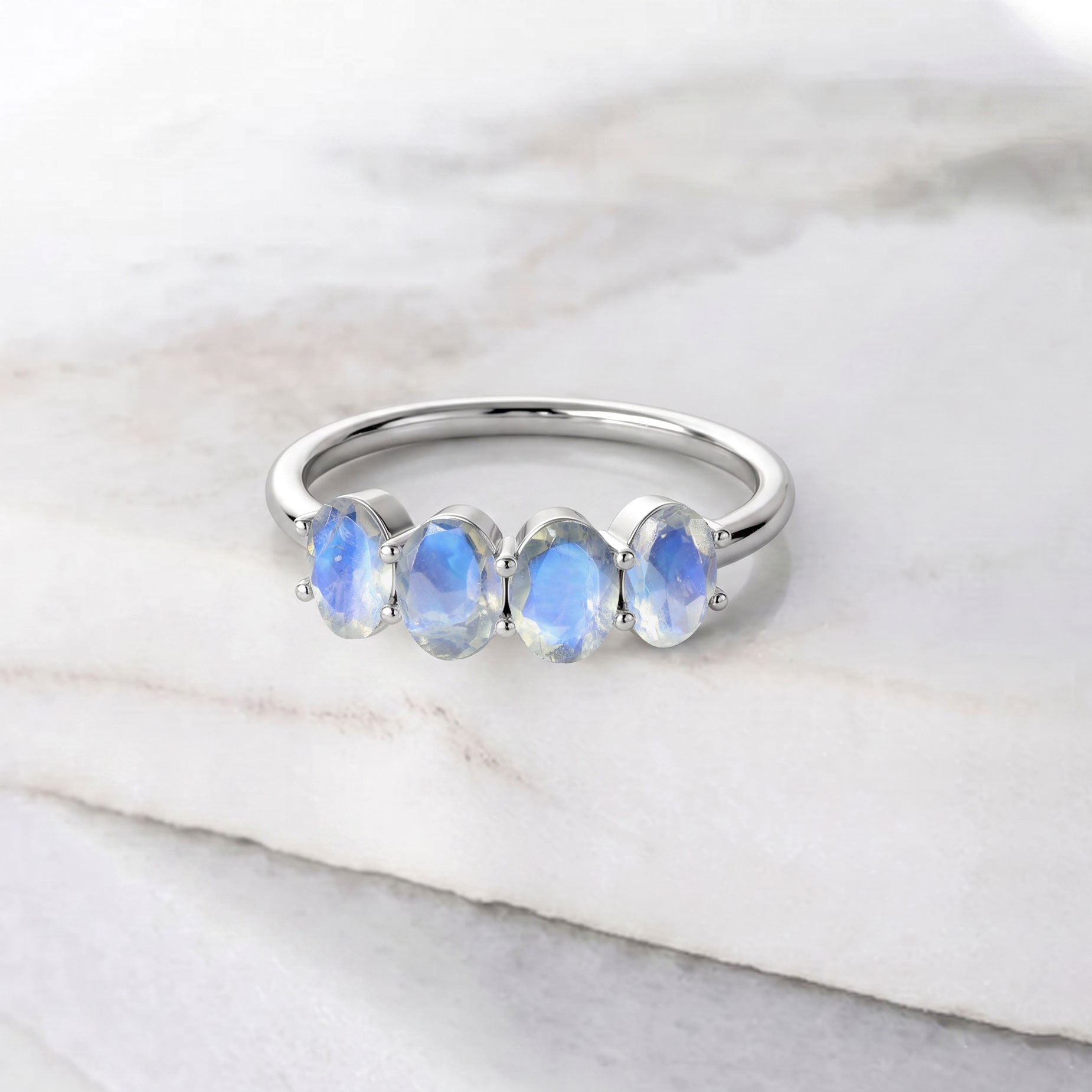 Lifestyle image of Genuine Moonstone Ring paired with elegant fashion accessories, natural moonstones with luminous blue flash, handcrafted sterling silver jewelry, minimalist stackable ring, June birthstone jewelry, artisan gemstone ring, luxury women's jewelry, sophisticated everyday style, premium handmade moonstone gift for special occasions