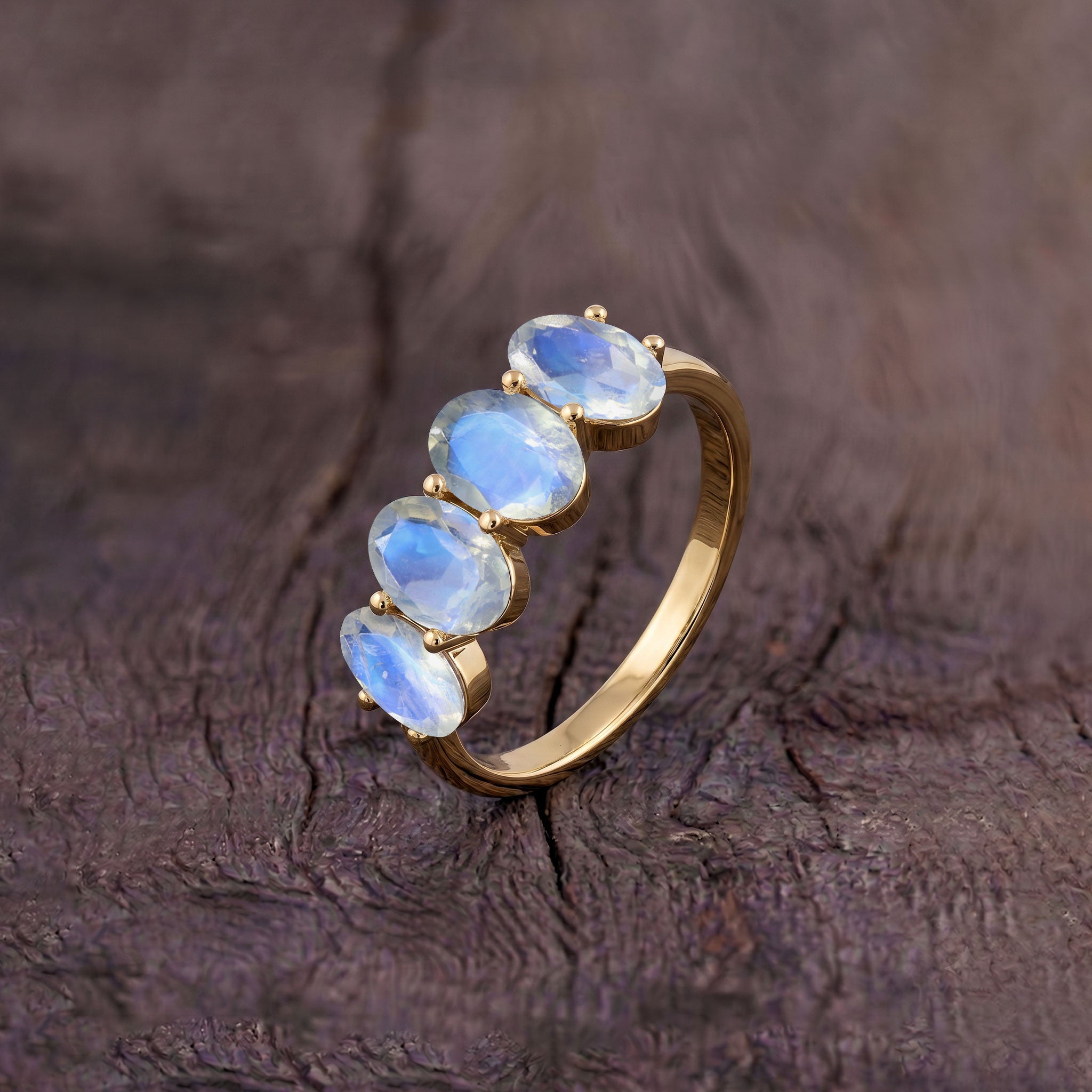 Side profile of Genuine Moonstone Ring showing secure prong setting, polished slim sterling silver band, four natural oval moonstones, blue flash gemstone beauty, handcrafted artisan jewelry, luxury stackable ring, June birthstone jewelry, elegant everyday ring, premium craftsmanship, durable fine jewelry designed for daily wear