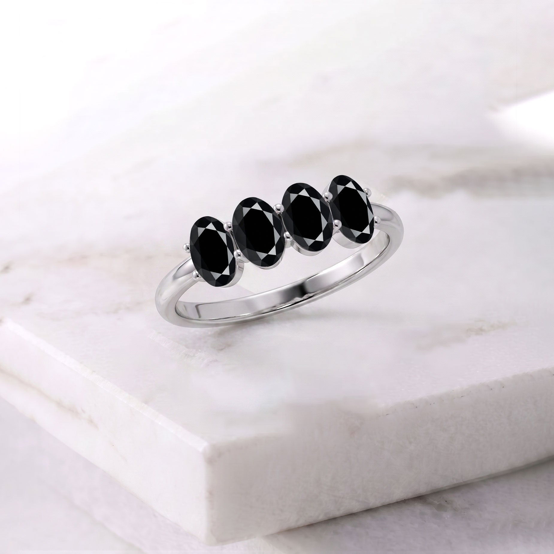 black onyx gemstone ring, four oval stone band, minimalist elegant jewelry, handcrafted fashion accessory, stackable ring, timeless gemstone design, everyday luxury, anniversary gift, women's jewelry, modern ring