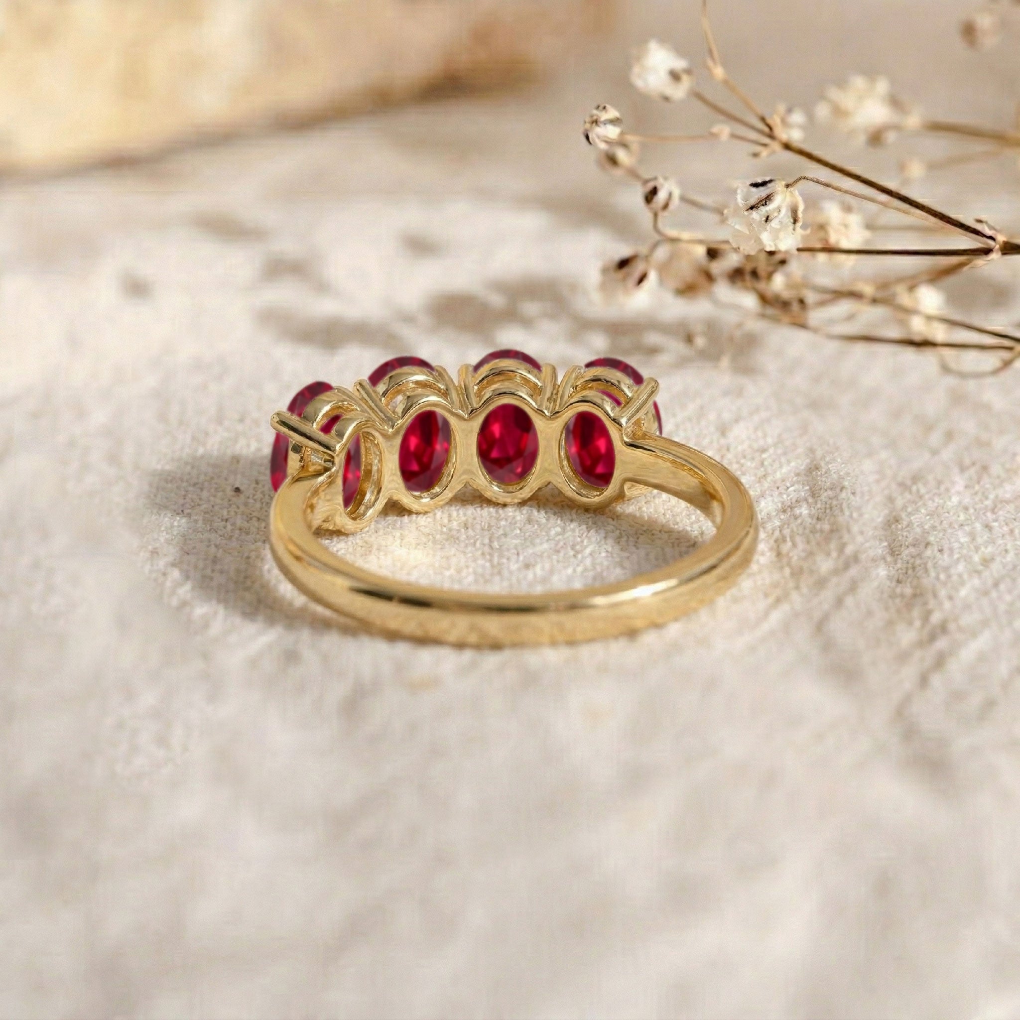 oval ruby gemstone ring, classic four stone design, handcrafted luxury jewelry, elegant minimalist band, vibrant crimson gemstone, premium fashion accessory, sophisticated women's ring, fine ruby craftsmanship, stacking jewelry, anniversary present