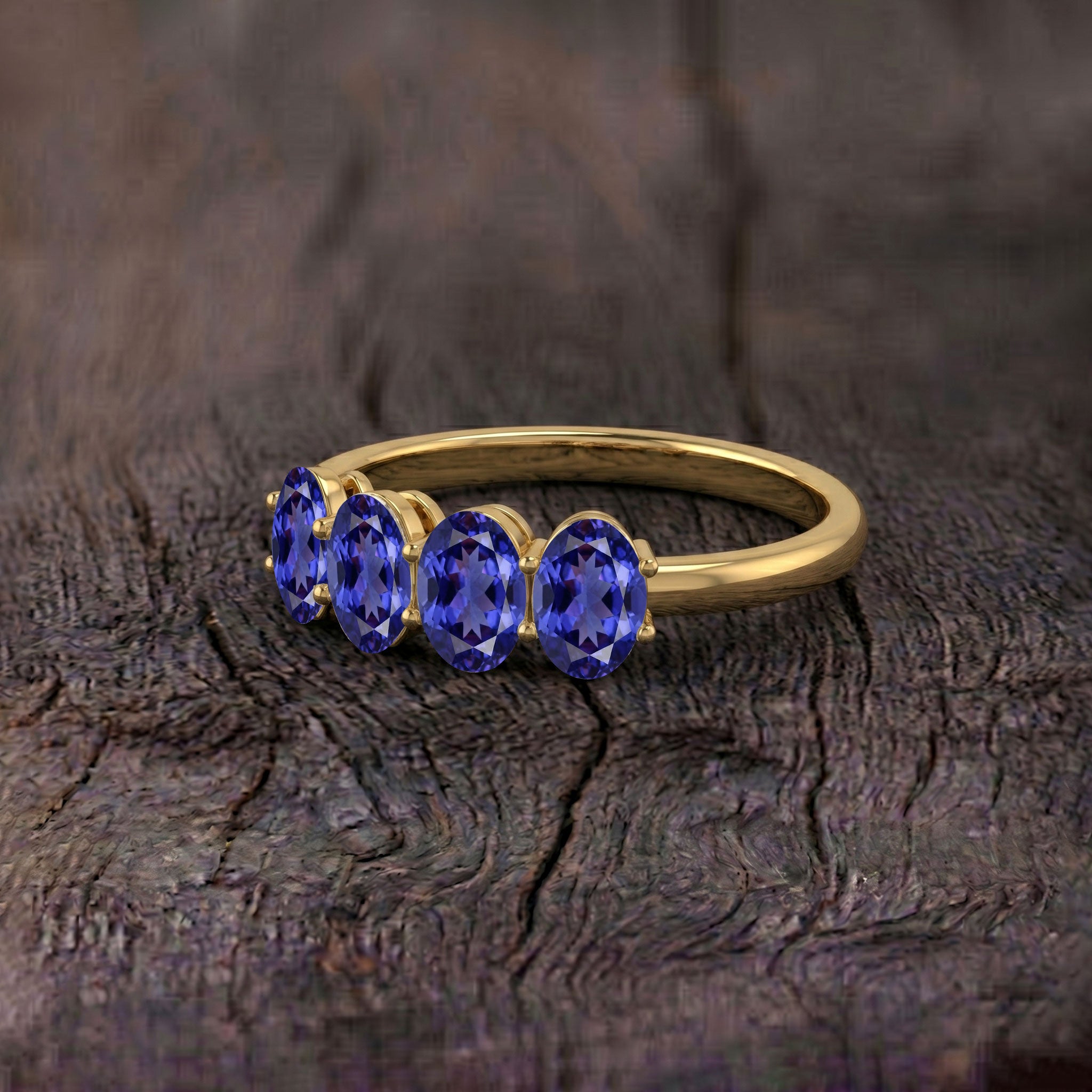 Natural 4 stone tanzanite ring, premium gold jewelry, boutique birthstone ring, exclusive artisan jewelry, luxury fashion accessory, elegant women's gift, fine gemstone jewelry, signature ring design, handcrafted luxury, sophisticated fashion ring