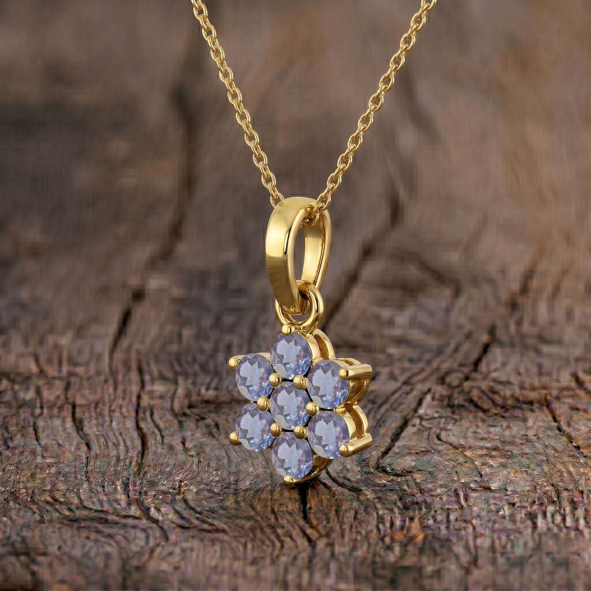 Fine jewelry Alexandrite flower pendant necklace featuring seven 3MM round gemstones.