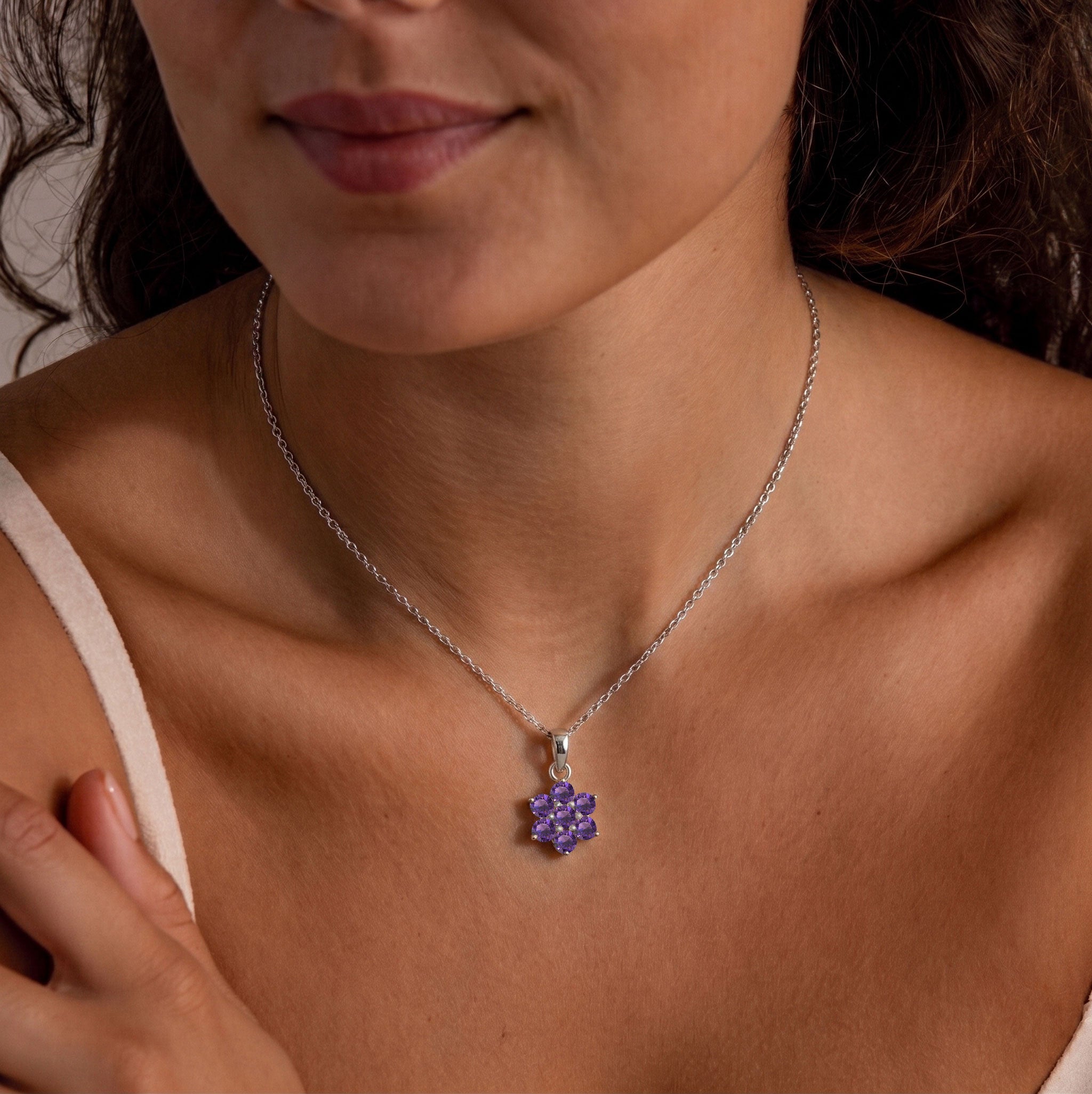 February birthstone pendant necklace featuring genuine Amethyst gemstones in an elegant floral design