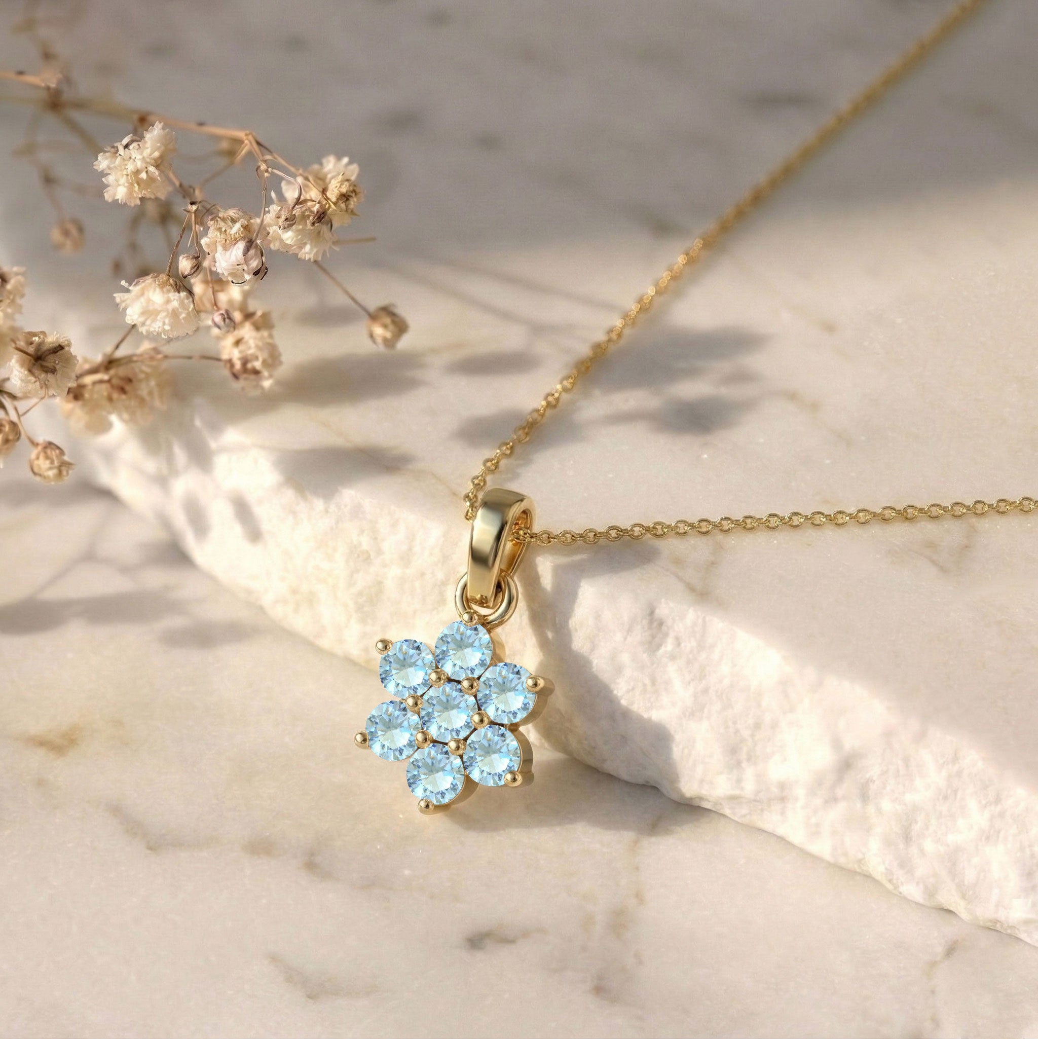 Fine jewelry Aquamarine floral necklace featuring seven 3MM round gemstones.