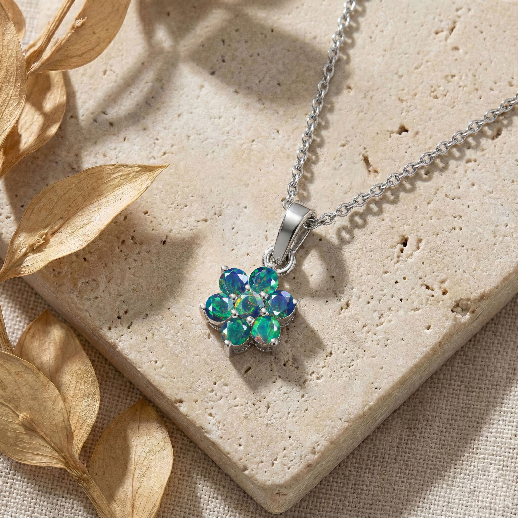 Genuine Black Opal gemstone floral necklace with seven round stones.