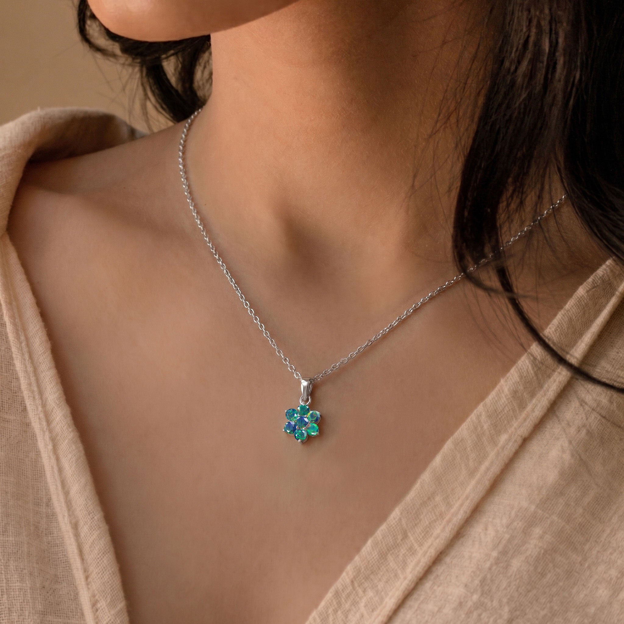 October birthstone Black Opal flower necklace with unique colorful gemstone sparkle.