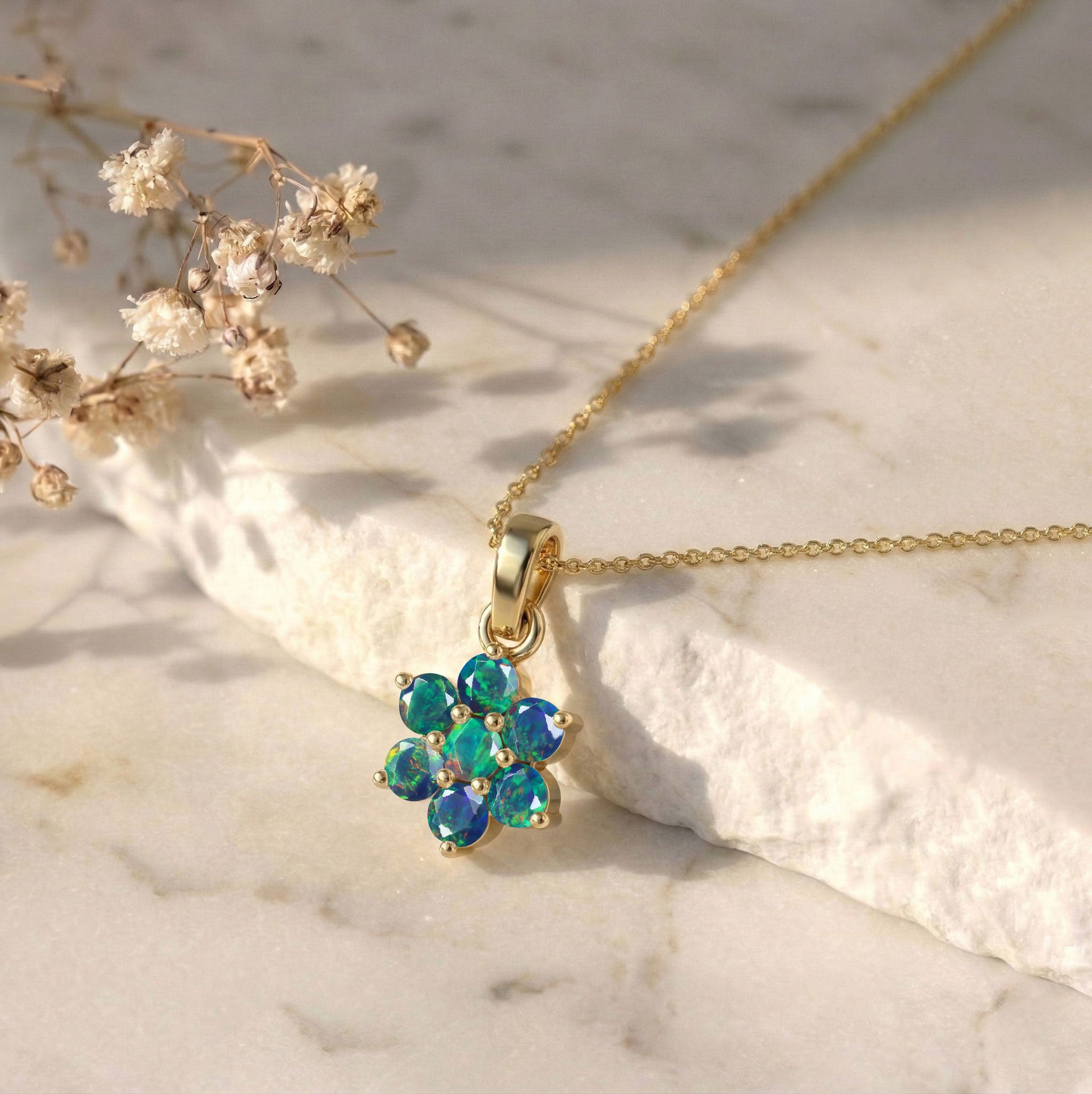 Fine jewelry Black Opal floral necklace with seven 3MM round gemstones.