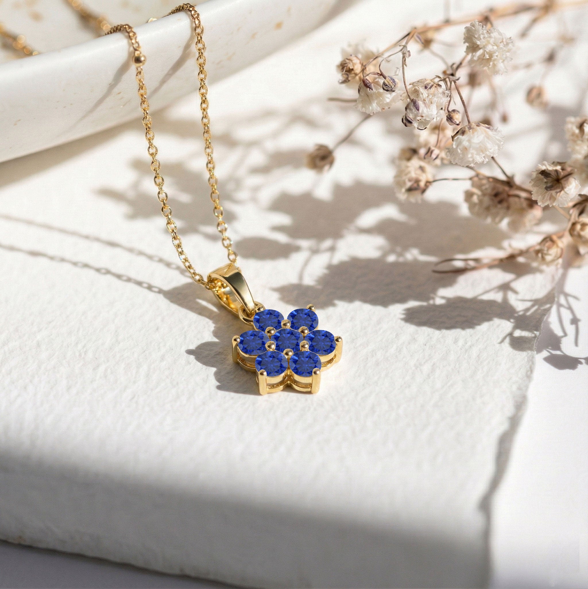 Floral Blue Sapphire pendant necklace crafted in Sterling Silver for everyday elegance.
