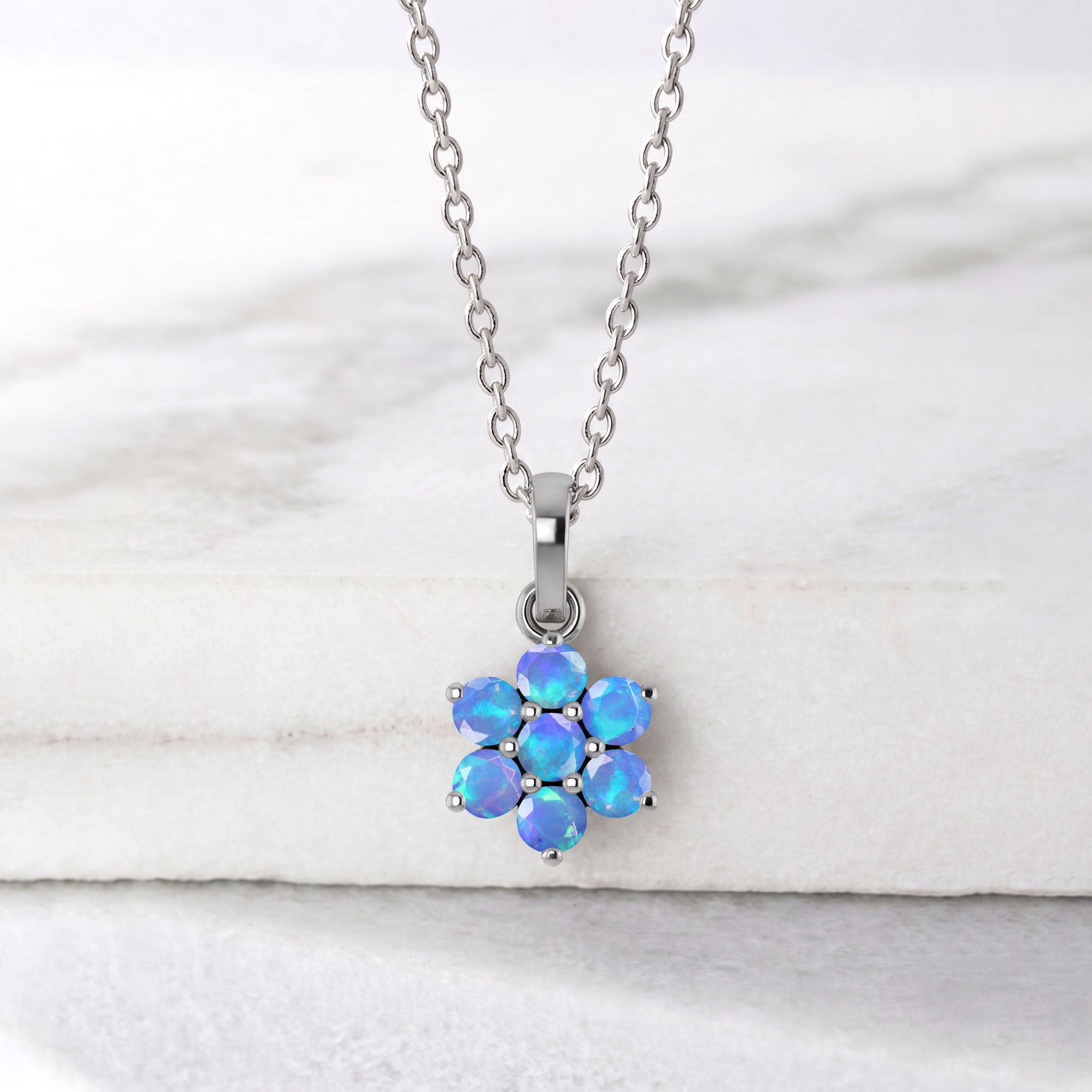 Yellow Gold Filled Blue Opal pendant necklace with sparkling blue gemstone details.