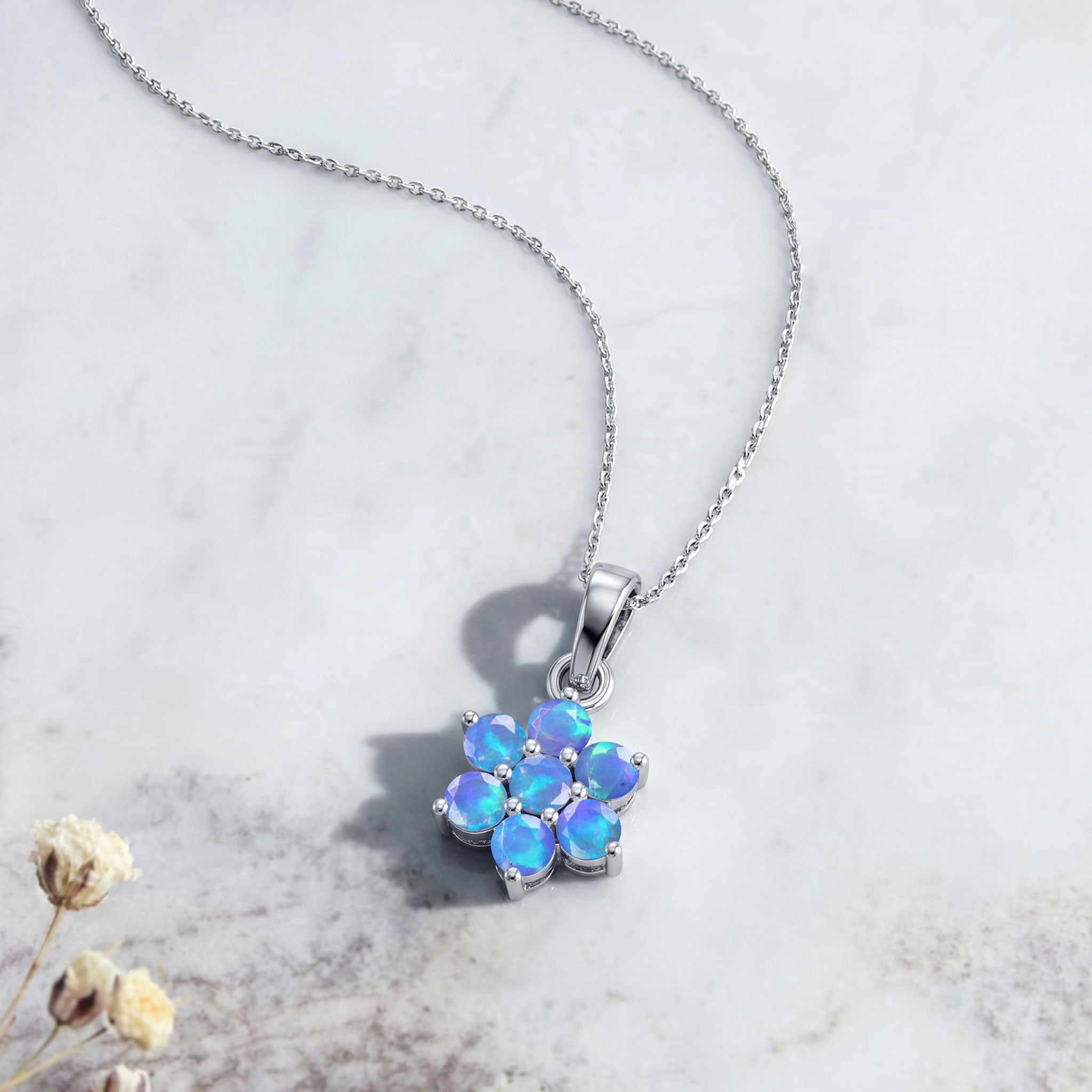 Beautiful Blue Opal flower pendant featuring seven round stones and elegant craftsmanship.
