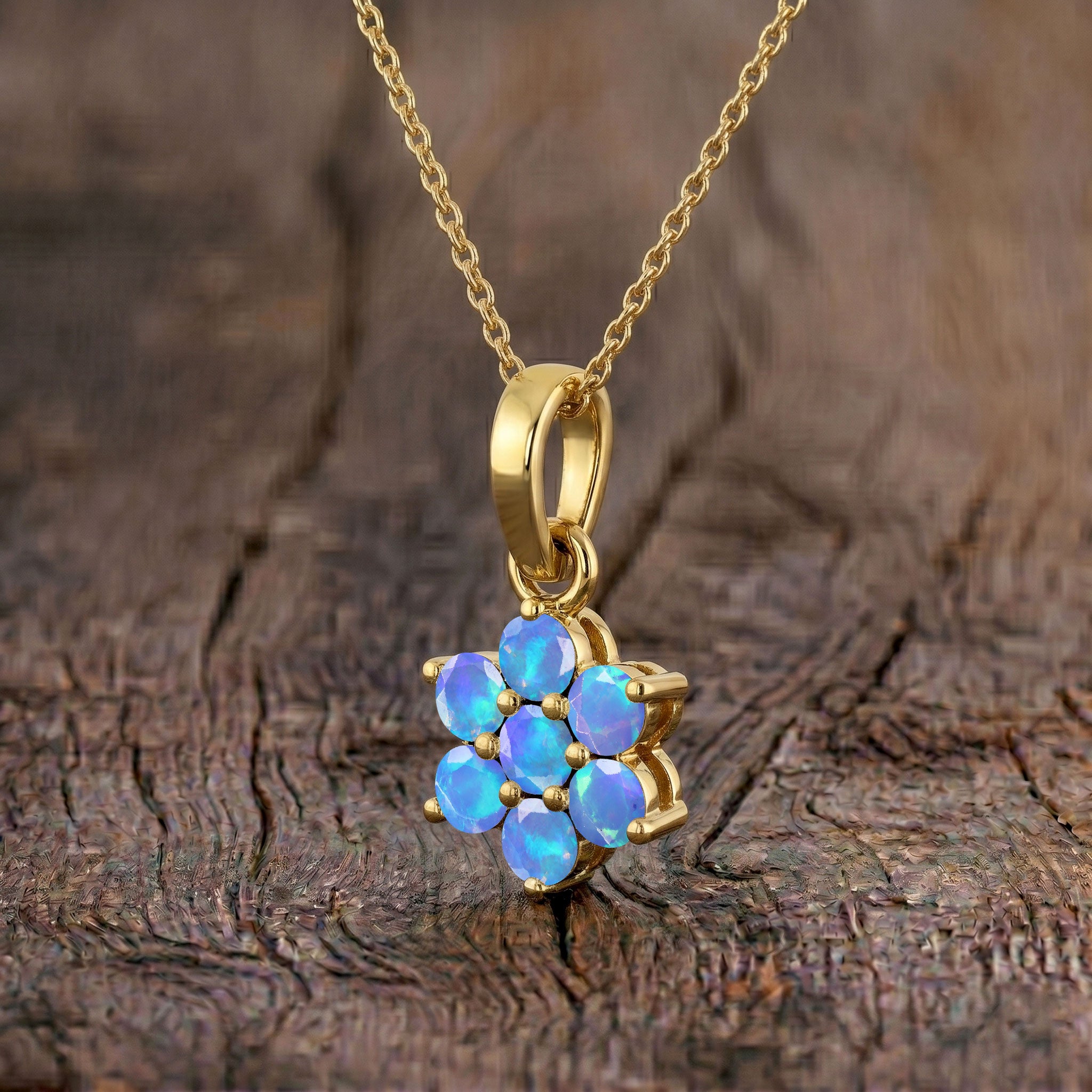 Fine jewelry Blue Opal flower pendant with a 16 inch chain and extender.