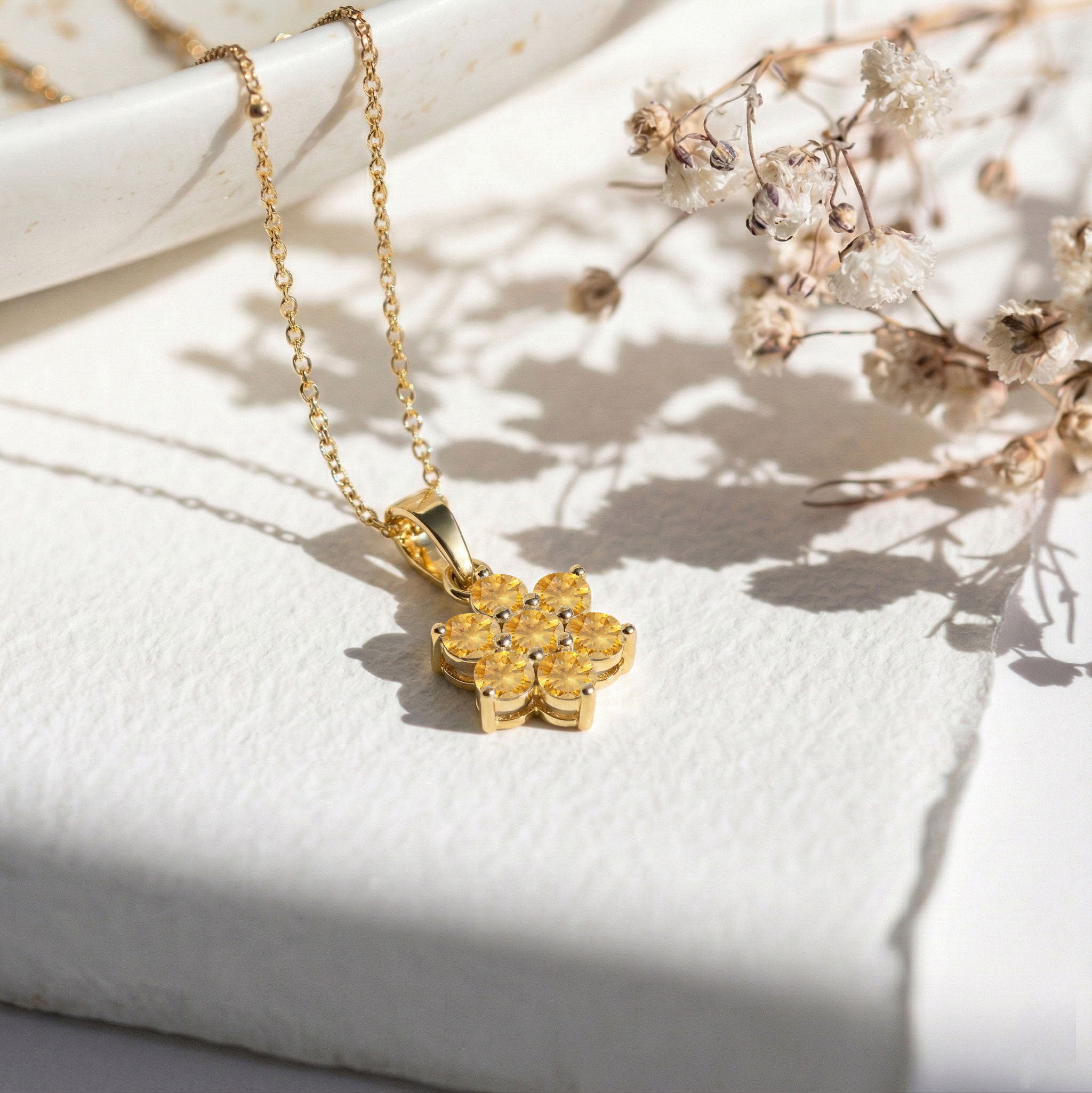 Flower pendant necklace featuring seven round citrine gemstones