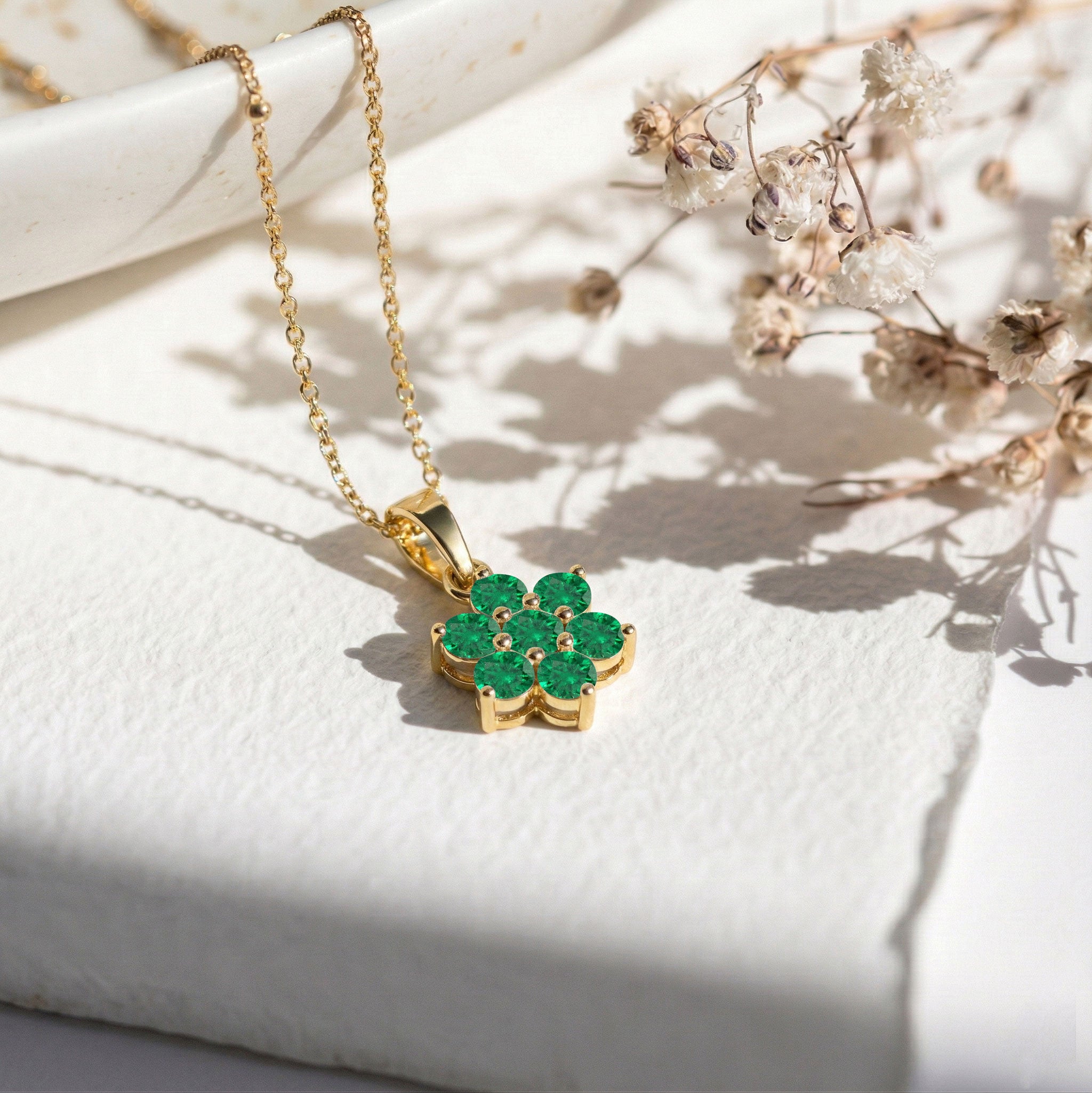Natural emerald gemstone pendant necklace inspired by blooming flowers