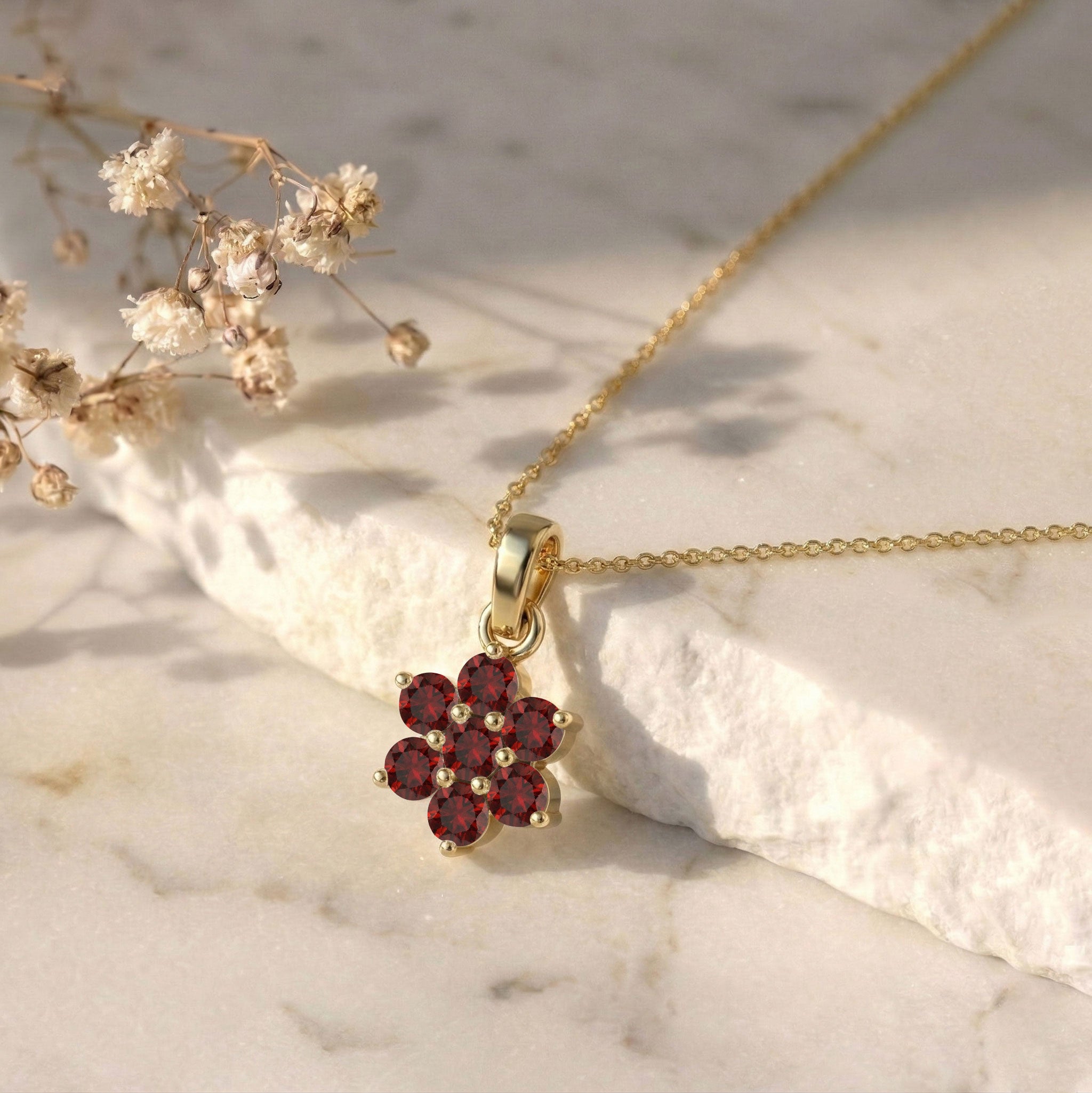 Minimalist floral garnet pendant necklace with gold accents