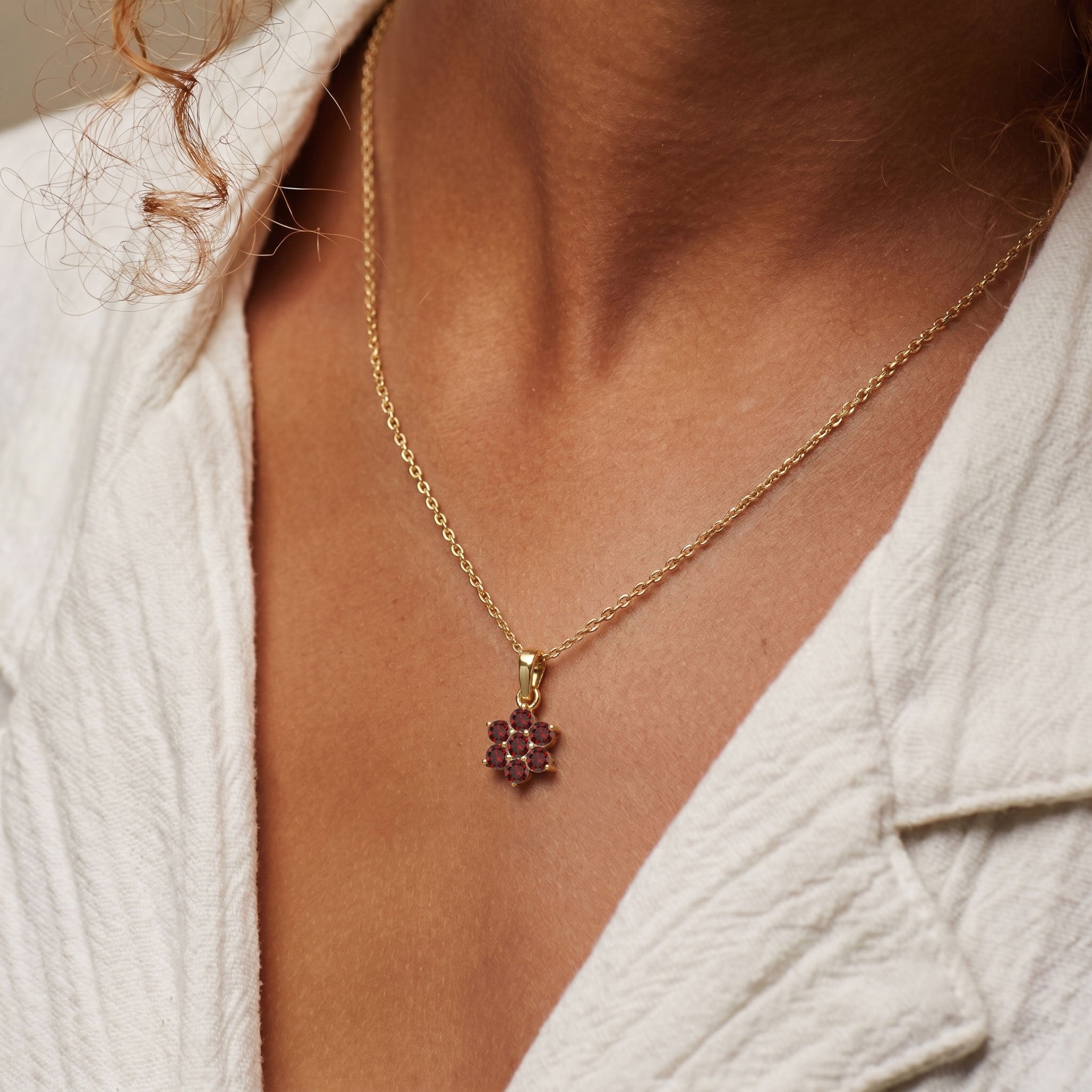 Sterling silver garnet necklace inspired by blooming flower design