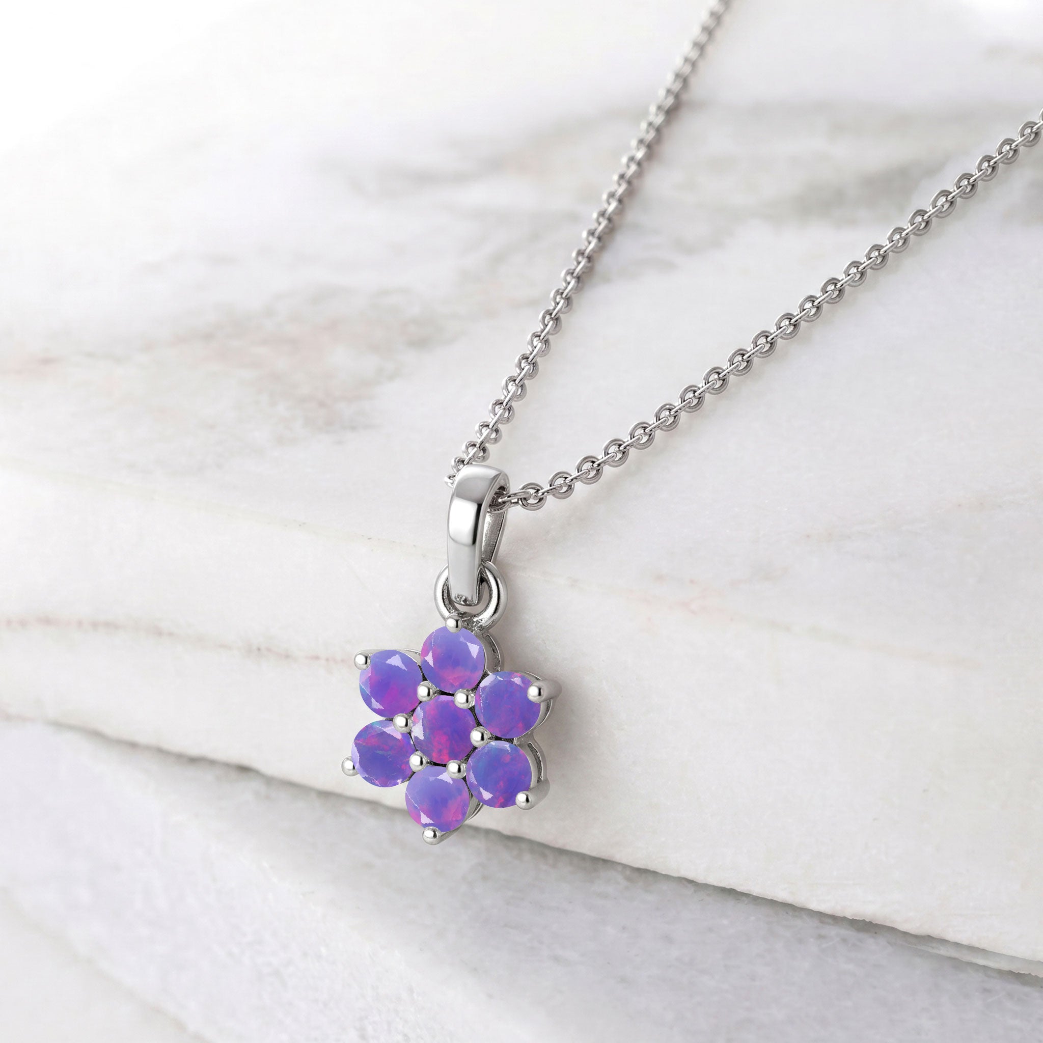 Floral gemstone necklace featuring seven round lavender opal stones