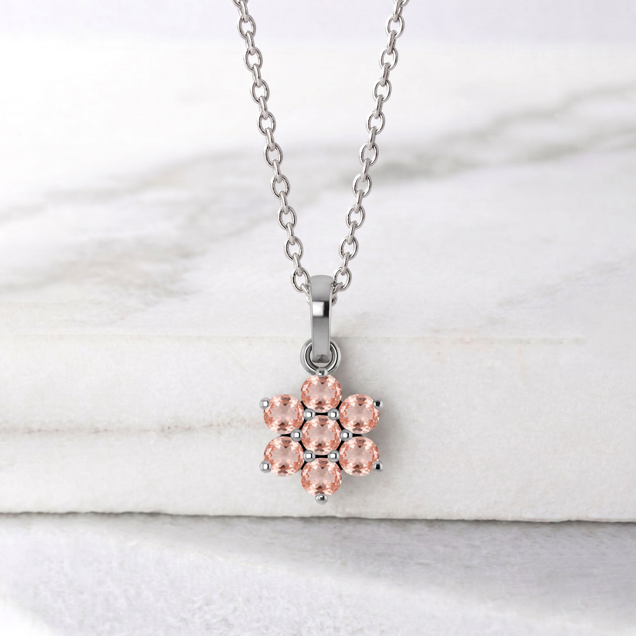 Floral gemstone necklace featuring seven round morganite stones