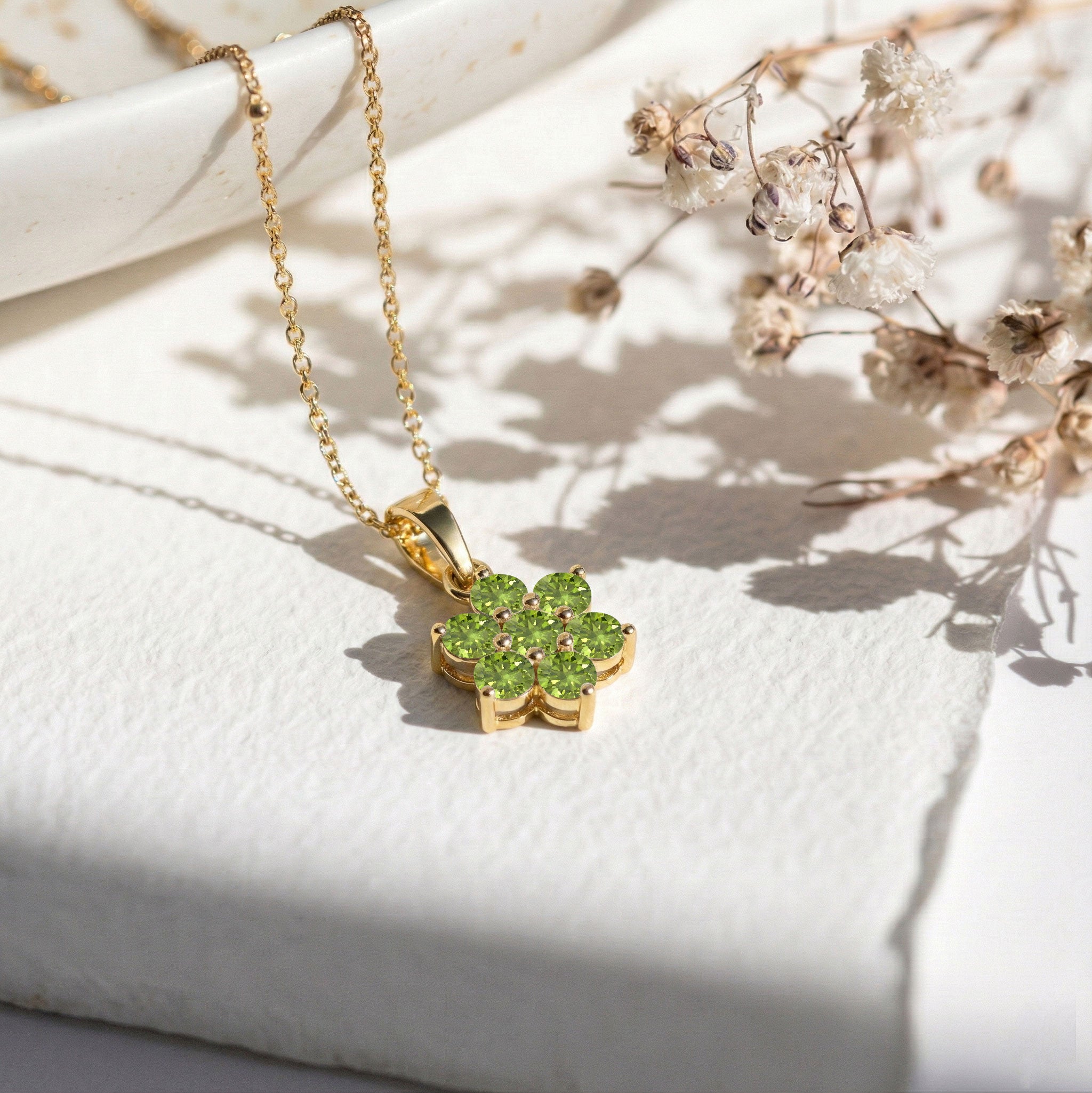 Minimalist floral pendant necklace with green peridot gemstones