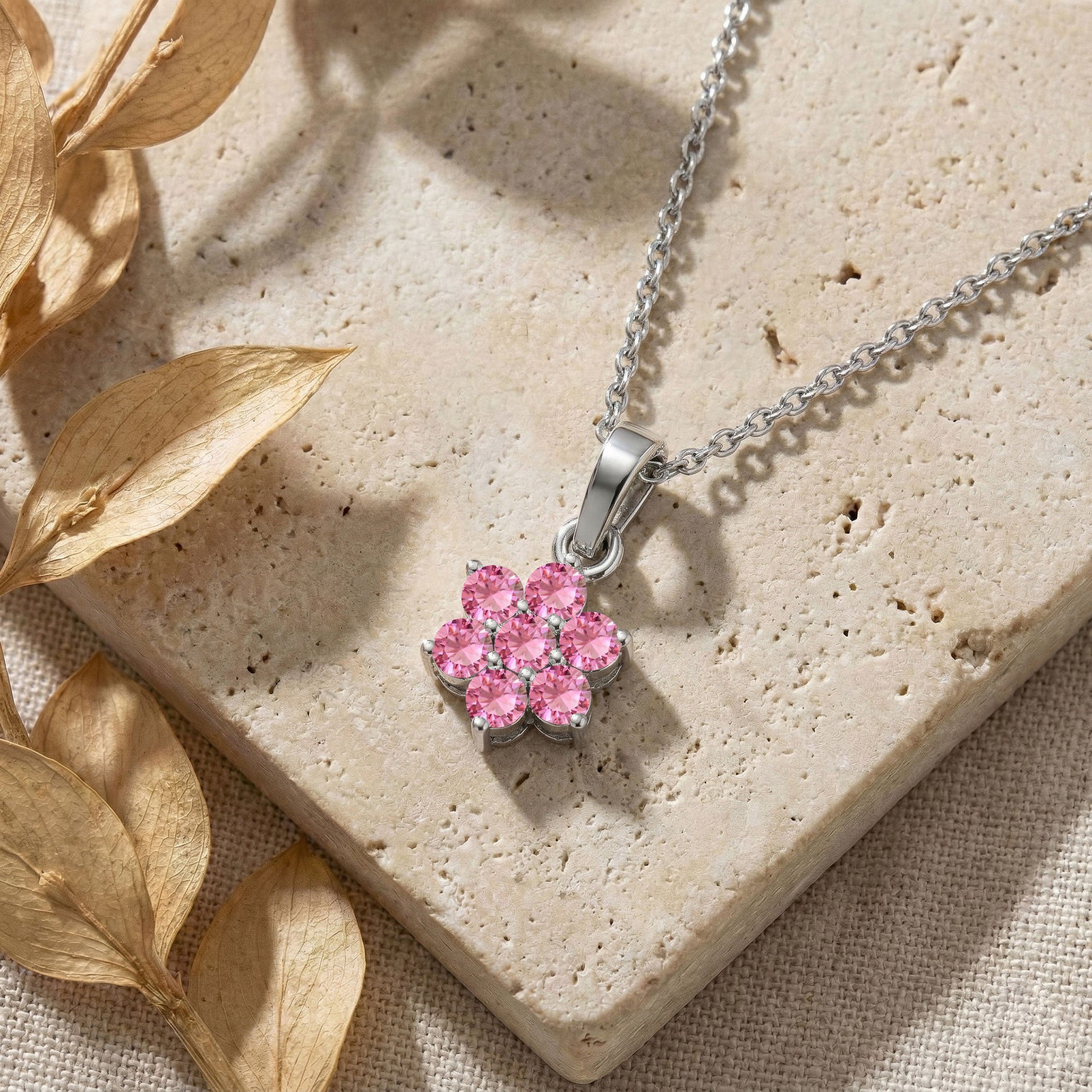 Floral gemstone necklace featuring seven round pink tourmaline stones