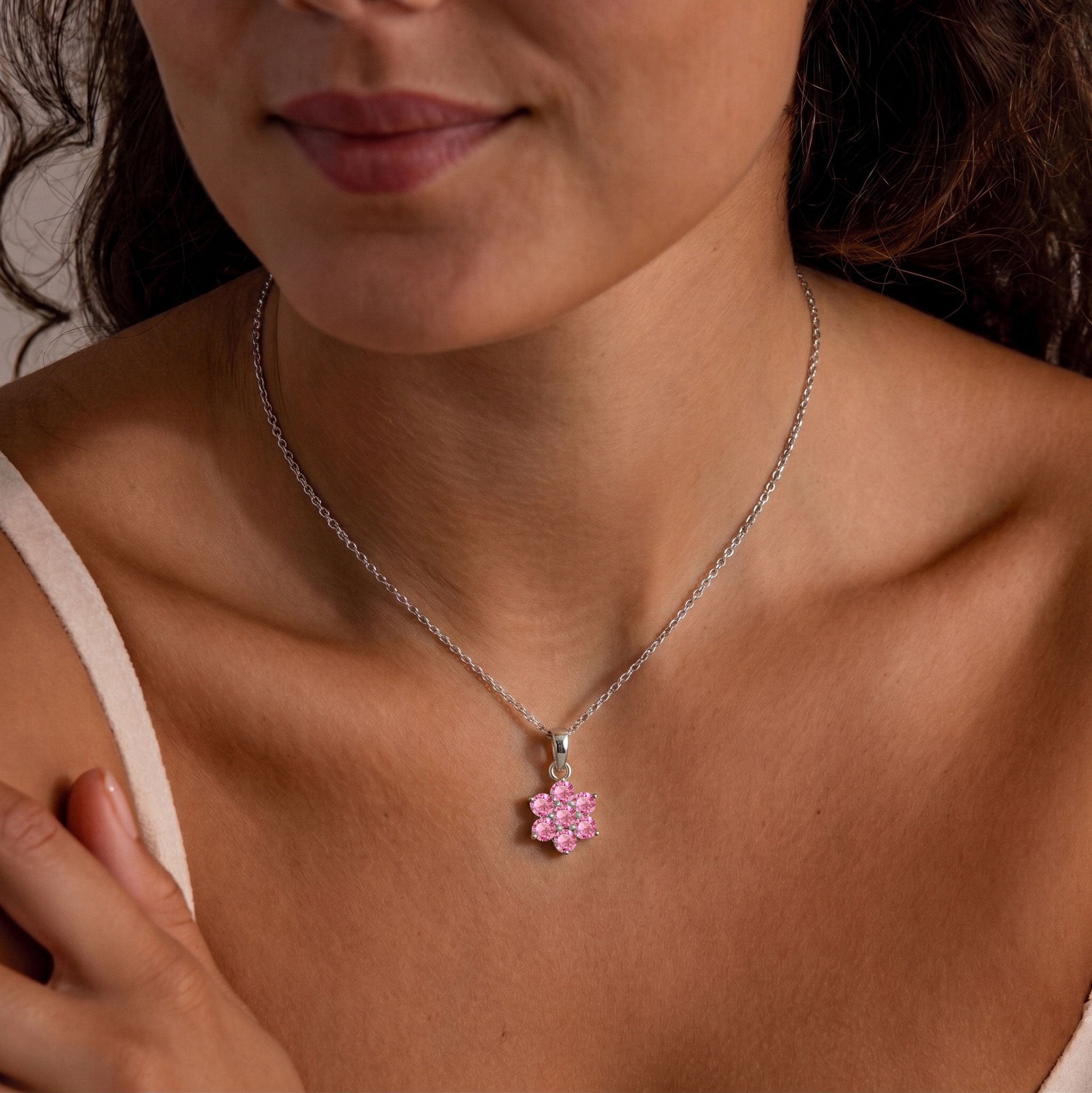 Elegant pink tourmaline pendant necklace featuring floral gemstone design