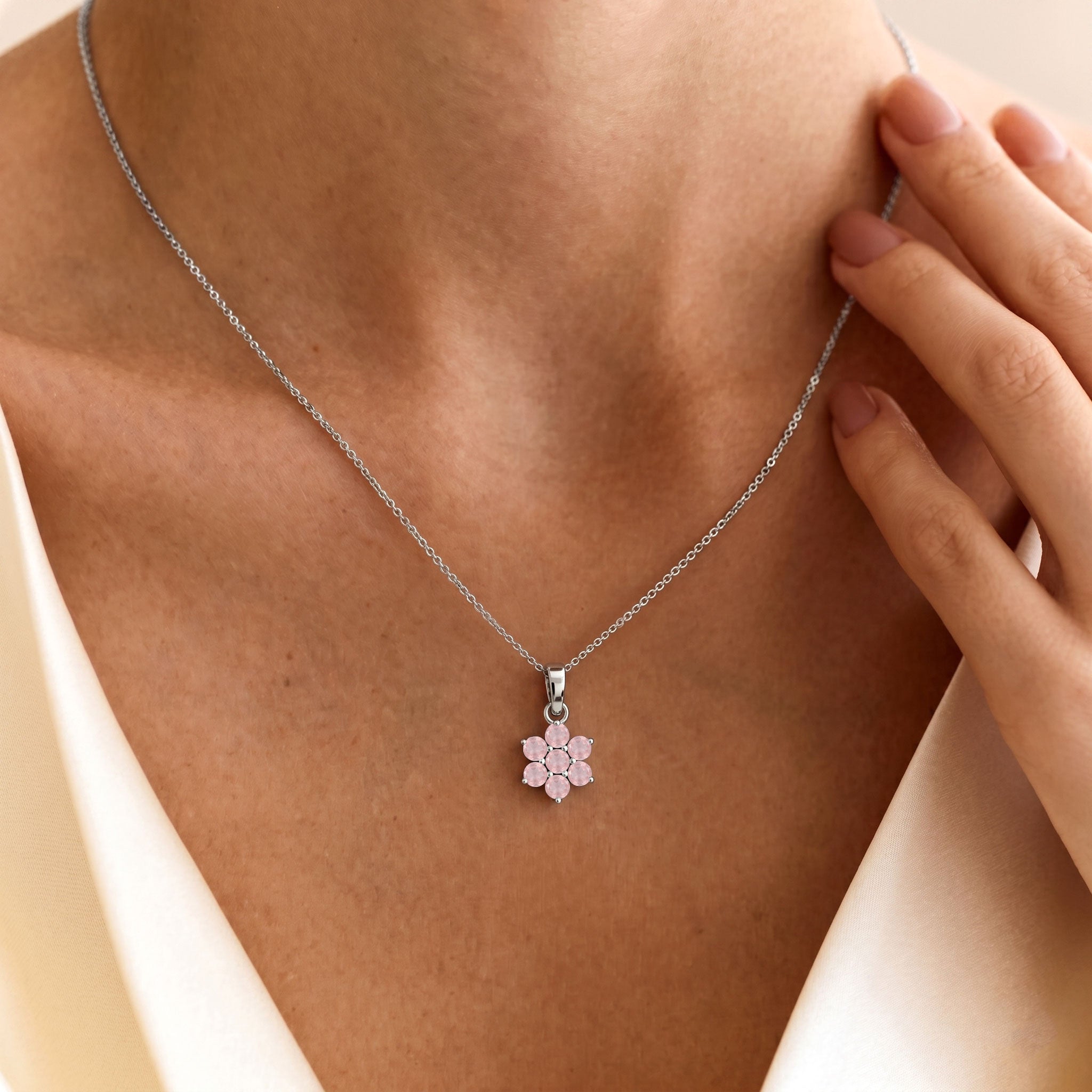 Dainty rose quartz pendant necklace with delicate flower pendant design