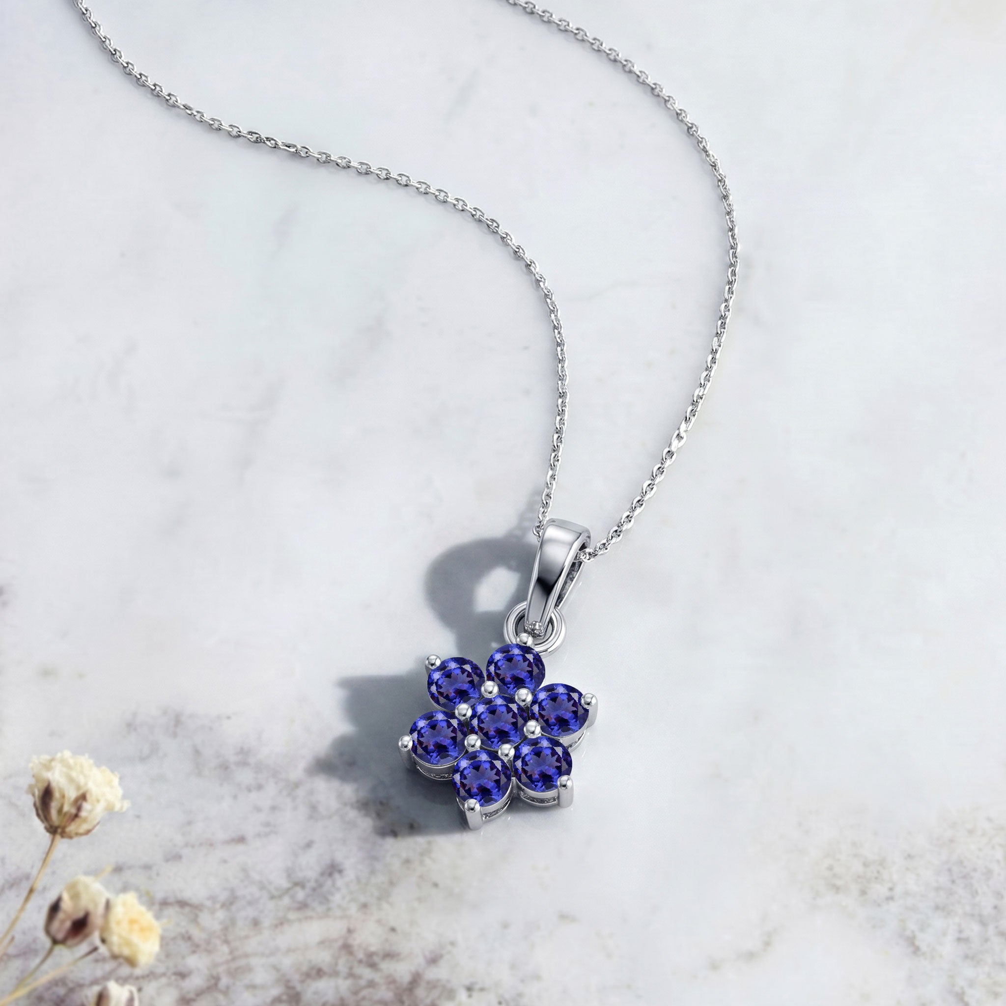 Luxury tanzanite flower jewelry with handcrafted gemstone pendant details