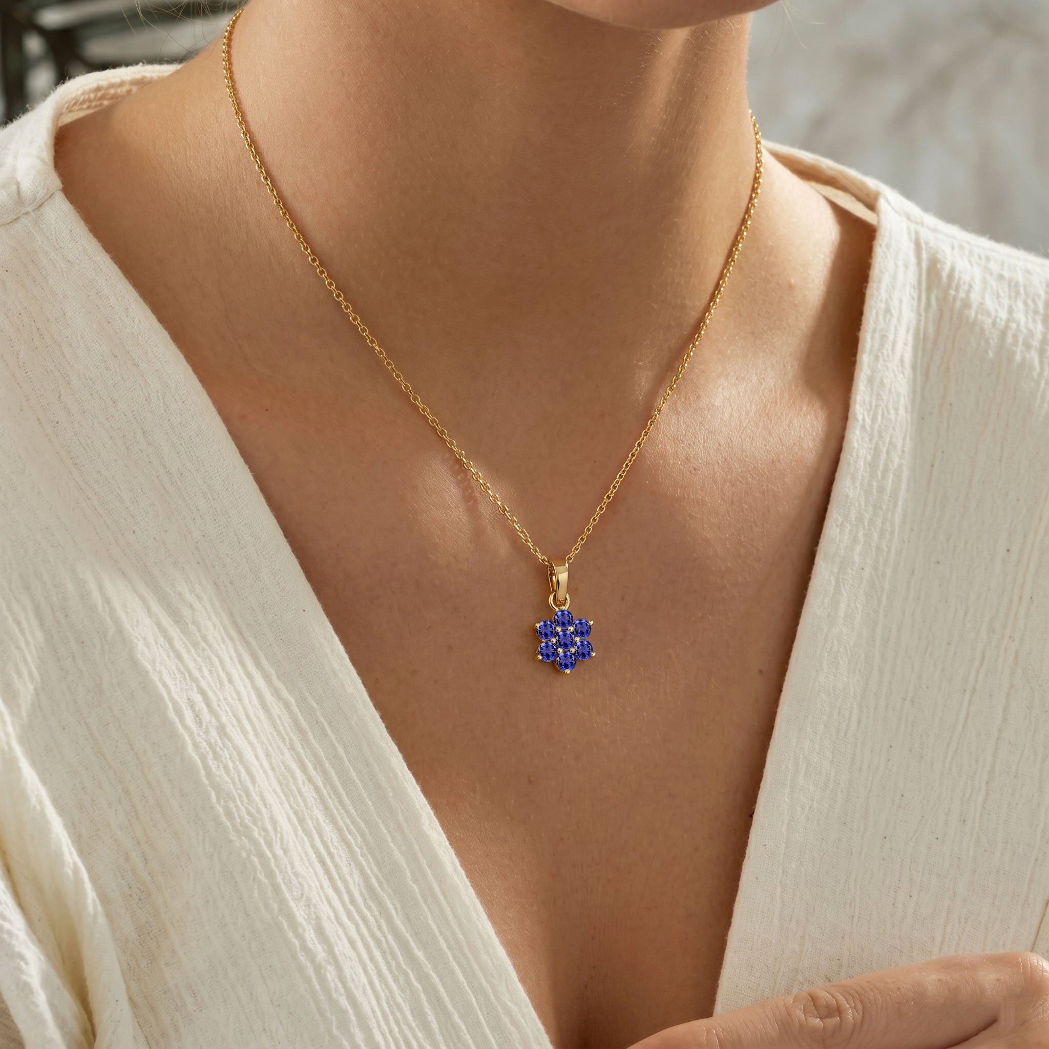 Blue purple tanzanite gemstone pendant necklace with natural radiant sparkle