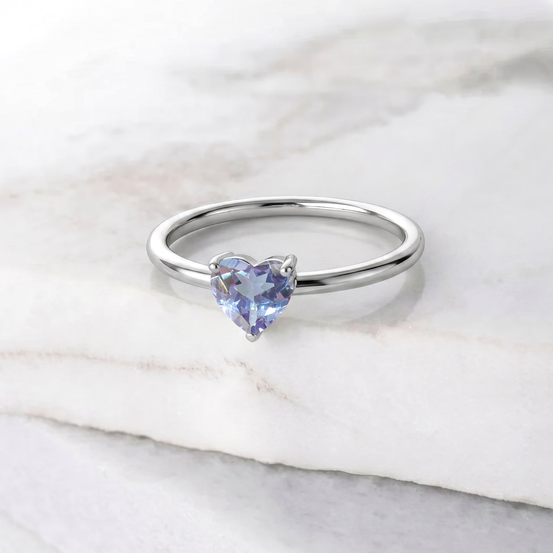 heart cut alexandrite gemstone, solitaire jewelry style, handcrafted artisan ring, women's elegant accessory, promise ring jewelry, anniversary jewelry gift, fine gemstone craftsmanship, polished ring design, timeless elegance, birthday jewelry inspiration, premium gemstone accessory, romantic jewelry, minimalist fashion, classic jewelry, gemstone beauty