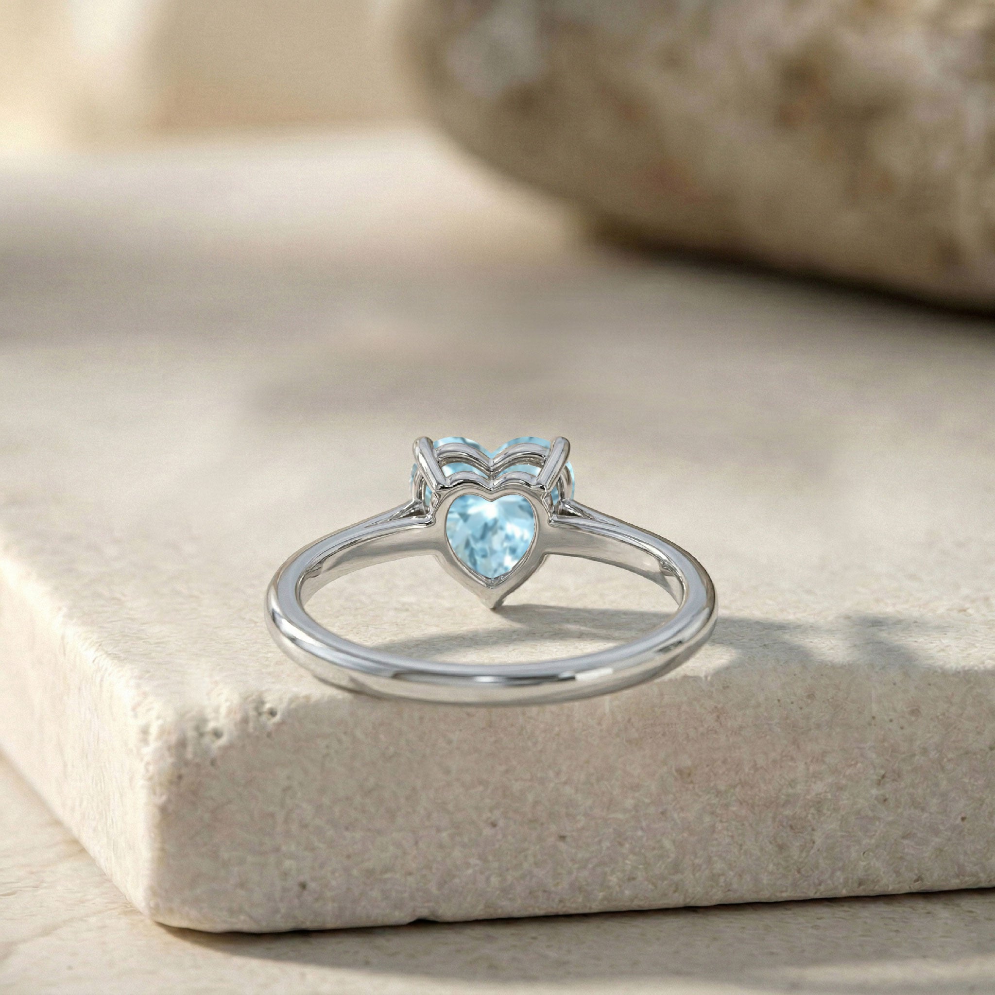 Aquamarine fine jewelry, heart solitaire ring, blue gemstone promise ring, minimalist ring for women, elegant jewelry accessory, March birthstone keepsake, handcrafted craftsmanship, polished finish, romantic jewelry gift, anniversary ring, stackable accessory, bridal inspiration, feminine design, luxury ring, everyday elegance