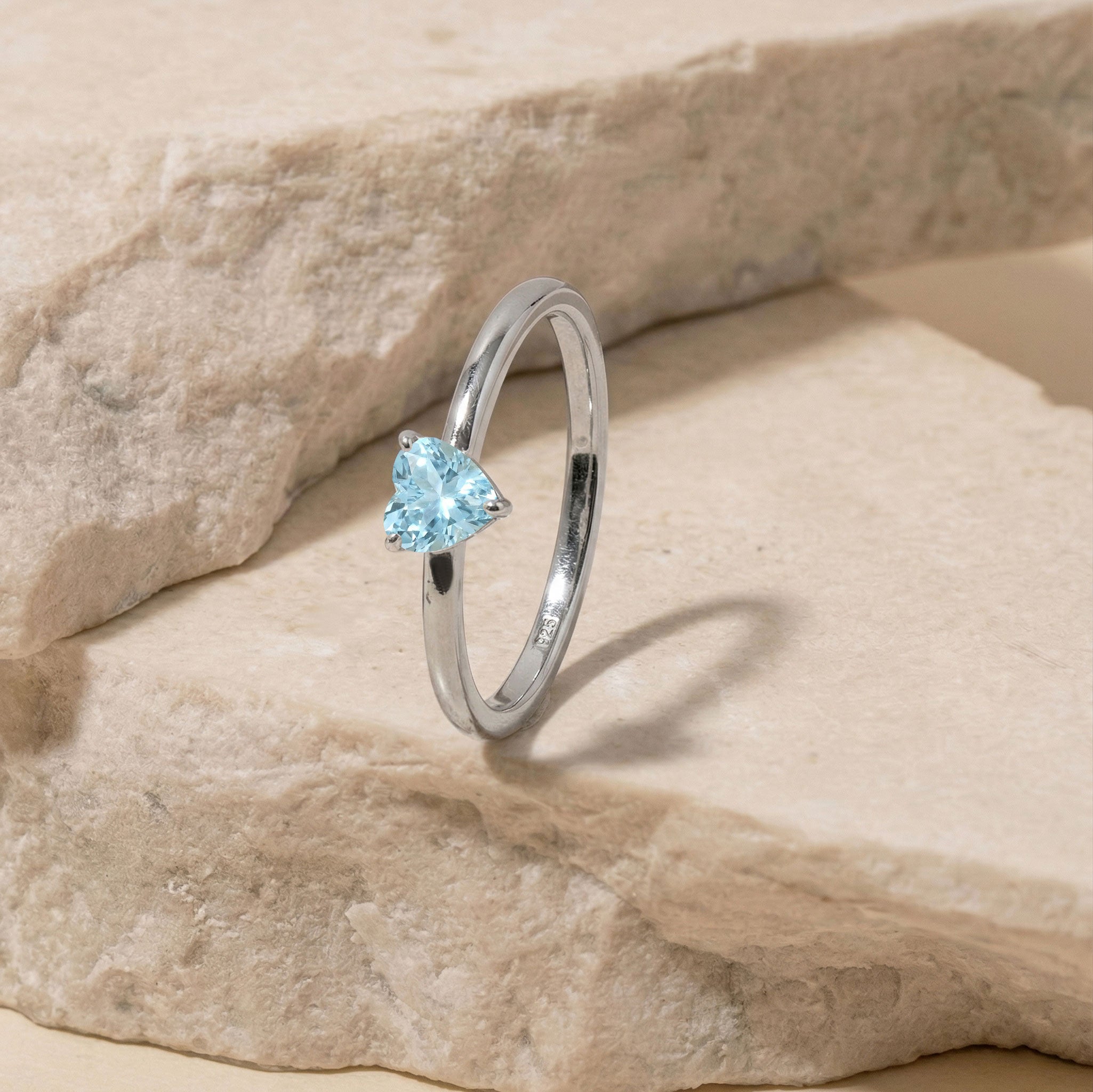 Heart aquamarine jewelry ring, solitaire gemstone design, blue crystal accessory, elegant promise jewelry, women's minimalist ring, fine craftsmanship, March birthstone fashion, anniversary jewelry gift, polished sterling style, stackable ring, bridal inspiration, romantic keepsake, gemstone elegance, luxury accessory, timeless beauty
