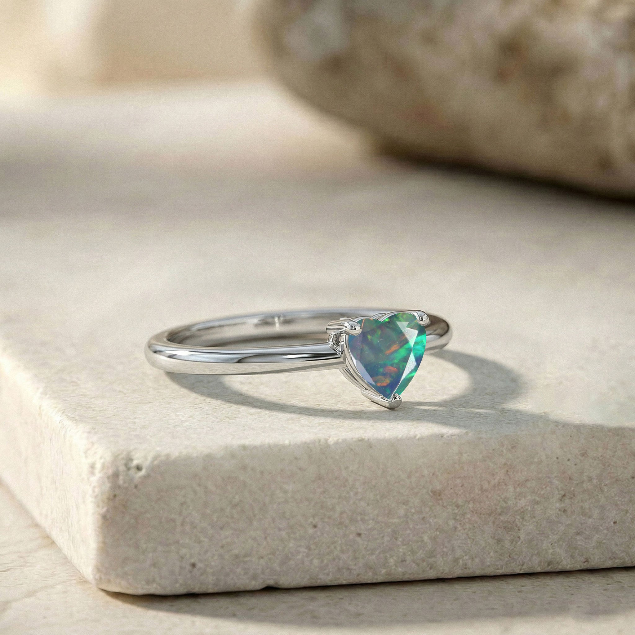 heart black opal gemstone, solitaire ring for women, natural gemstone jewelry, colorful opal flashes, dainty promise jewelry, polished ring, everyday jewelry, artisan craftsmanship, elegant accessory, luxury jewelry gift, romantic heart ring, birthday jewelry, timeless design, fashion ring, gemstone elegance