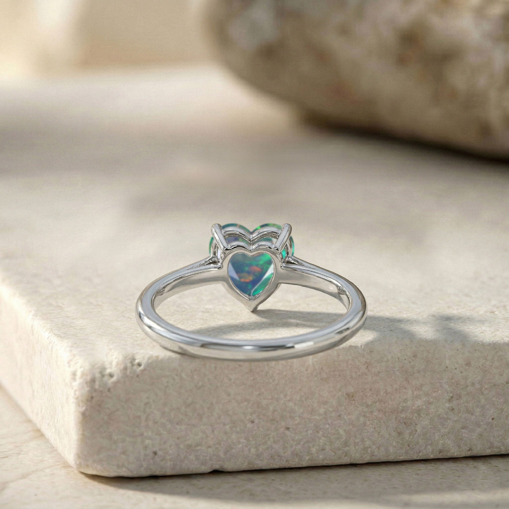 heart solitaire black opal, natural gemstone jewelry, colorful fire gemstone, handcrafted women's ring, polished finish, elegant stacking jewelry, anniversary jewelry gift, romantic accessory, timeless gemstone ring, artisan craftsmanship, fashion jewelry, luxury ring, birthday present, dainty elegance, gemstone design