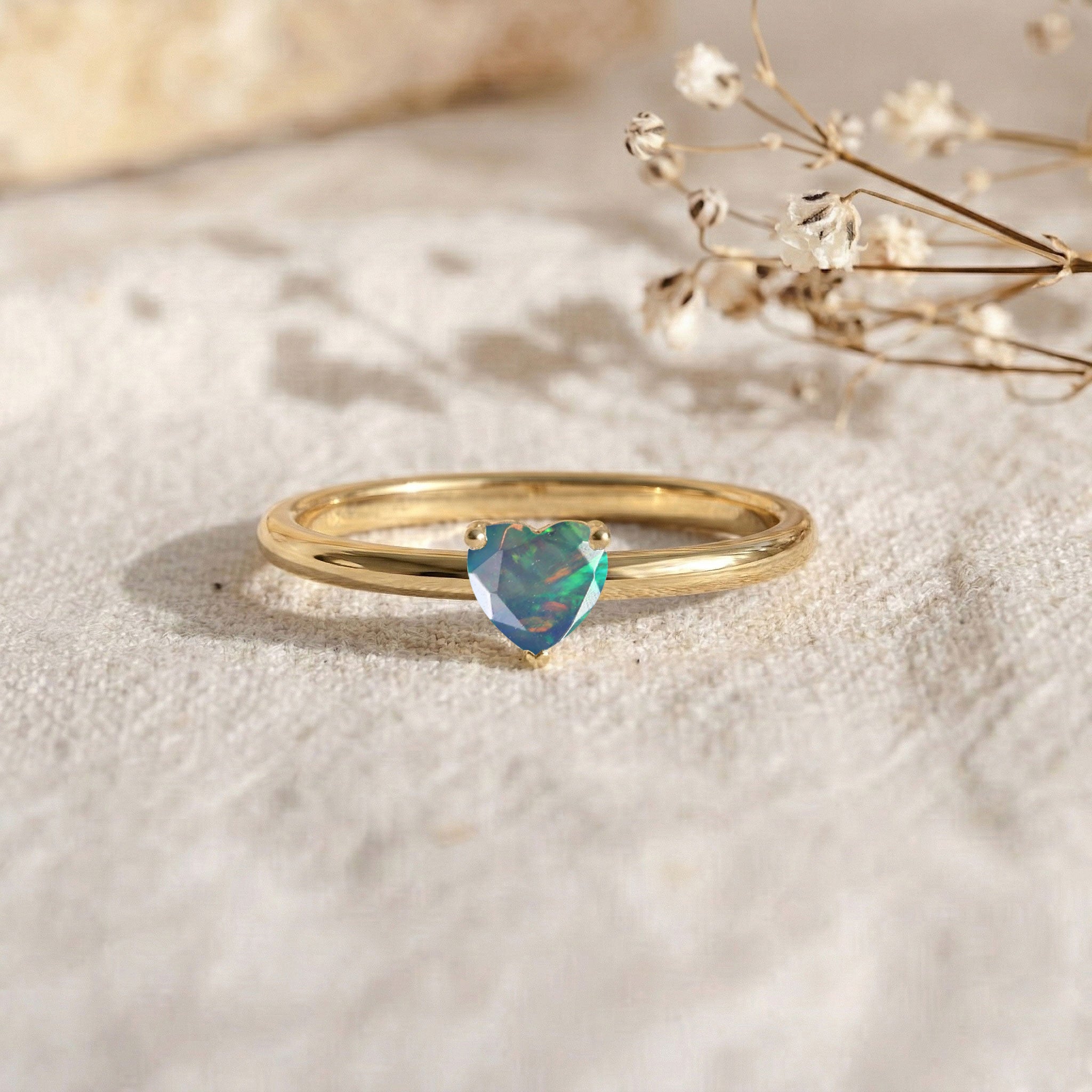 natural black opal jewelry, heart shaped gemstone, solitaire engagement ring, women's fine jewelry, handcrafted ring, colorful gemstone flashes, elegant promise ring, birthday gift, luxury ring, minimalist style, polished finish, gemstone accessory, romantic design, dainty jewelry, everyday elegance