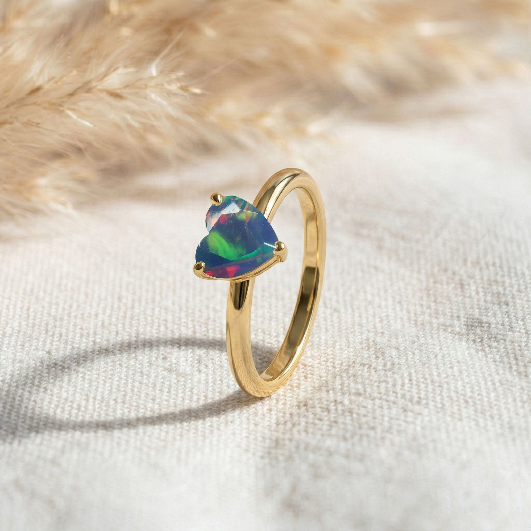 black heart opal ring, solitaire gemstone jewelry, natural gemstone accessory, colorful iridescent stone, women's jewelry gift, fine craftsmanship, elegant promise ring, minimalist fashion jewelry, polished silver finish, romantic keepsake, timeless ring, gemstone sparkle, birthday present, luxury ring, handmade jewelry