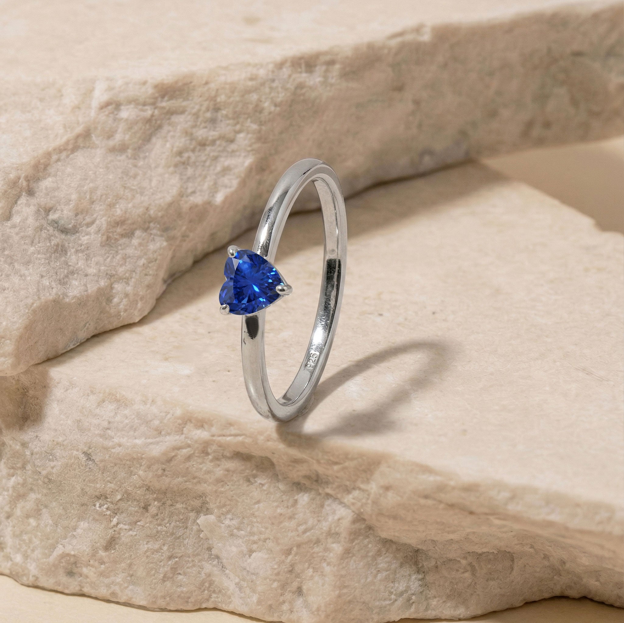 romantic sapphire heart ring, handcrafted gemstone jewellery, sterling silver solitaire ring, yellow gold filled heart jewellery, elegant blue gemstone, promise ring style, women's jewellery gift, september birthstone accessory, artisan ring design, polished finish, luxury jewellery piece, anniversary keepsake, fine fashion ring, timeless elegance, handcrafted gift