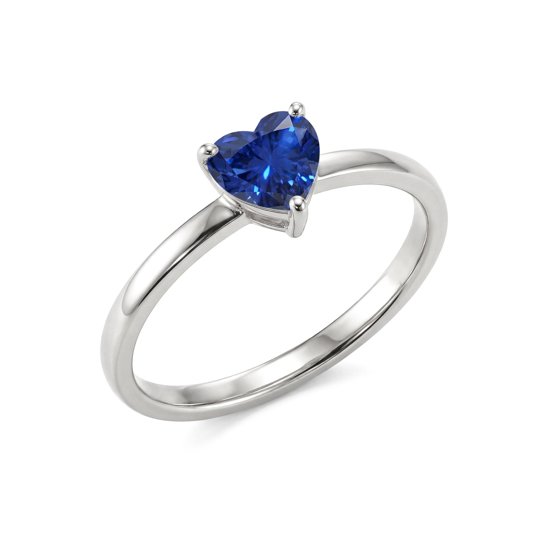 heart gemstone promise ring, blue sapphire jewellery, sterling silver artisan ring, yellow gold filled handcrafted jewellery, elegant solitaire setting, women's luxury ring, september birthstone jewellery, anniversary gift idea, polished gemstone brilliance, romantic fashion accessory, minimalist design, fine jewellery collection, handmade craftsmanship, timeless keepsake, sapphire gift